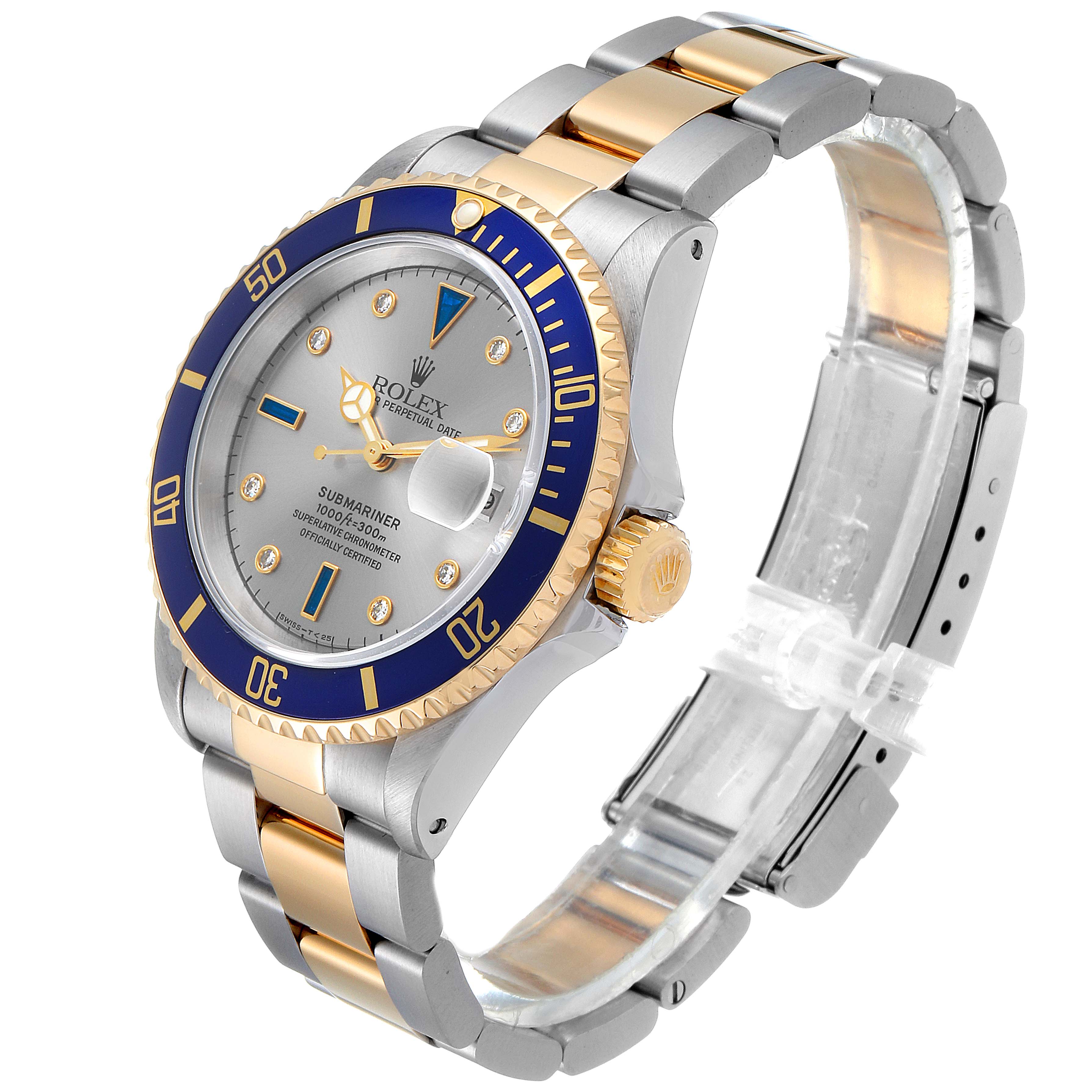The image shows a Rolex Submariner 16613 Men's Steel and Gold (two tone) Grey Dial 16613 Men's Steel and Gold (two tone) Grey Dial watch at an angled view, highlighting its dial, bezel, crown, and two-tone bracelet.