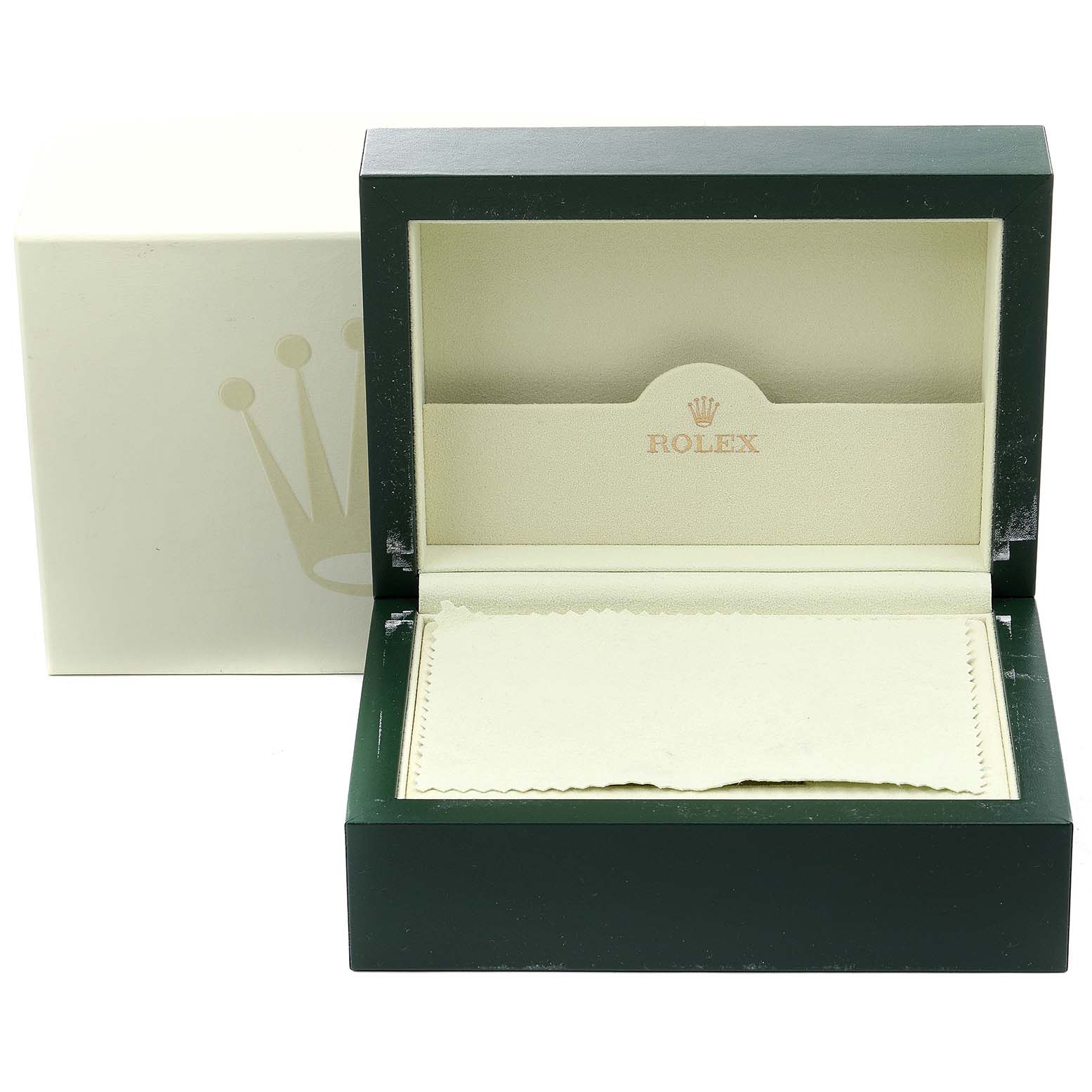 The image shows an open Rolex box for the Submariner model, displaying its interior with a cloth and outer box in the background.