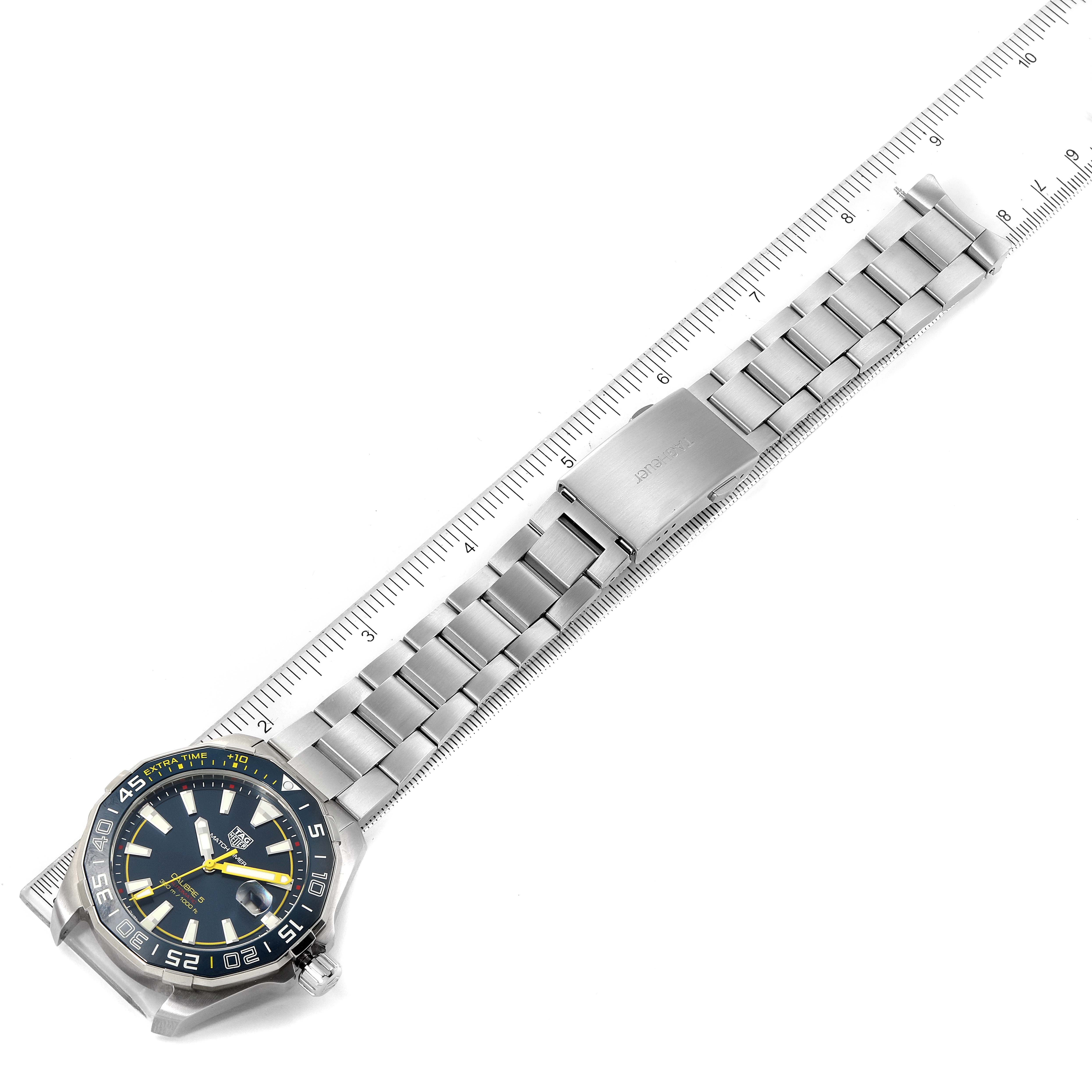 The image shows a Tag Heuer Limited Edition WAY201H.BA0927 Men's Stainless Steel Blue Dial WAY201H.BA0927 Men's Stainless Steel Blue Dial watch laid flat with its metal strap alongside a ruler for scale.