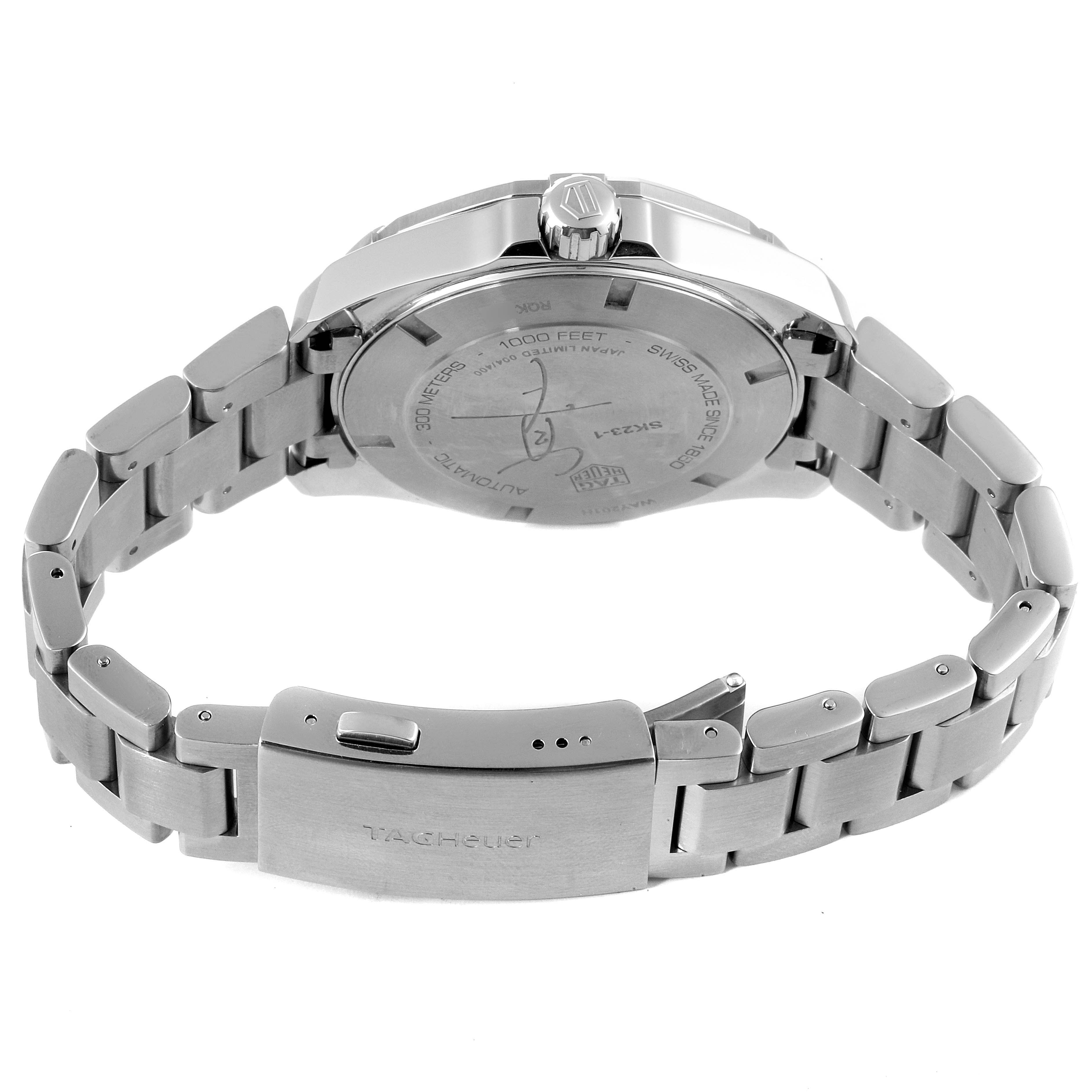 The image shows the back case and stainless steel bracelet of the Limited Edition Tag Heuer watch, focusing on the clasp and case back.