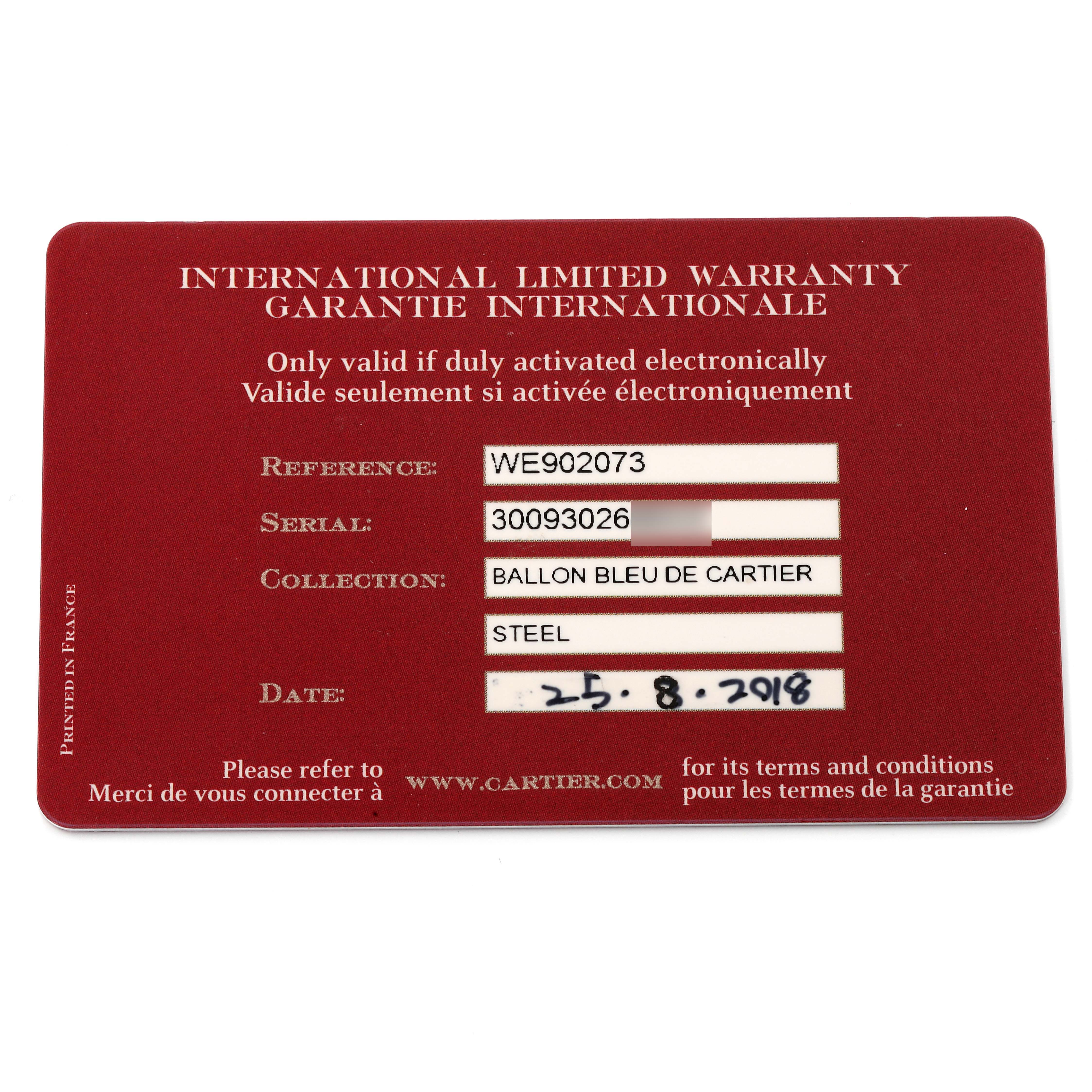 This image shows the Cartier "Ballon Bleu de Cartier" watch's international limited warranty card at a top-down angle.