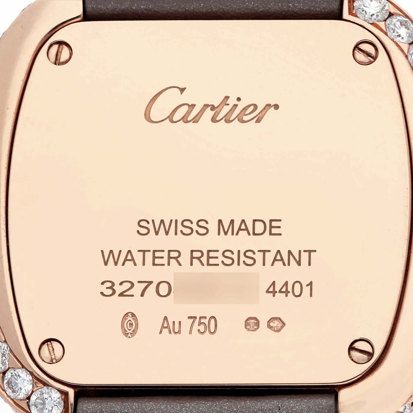 The image shows the back case of the Cartier Coussin WJCS0005 Women's Rose Gold Silver Dial watch, featuring screws and engraved details.
