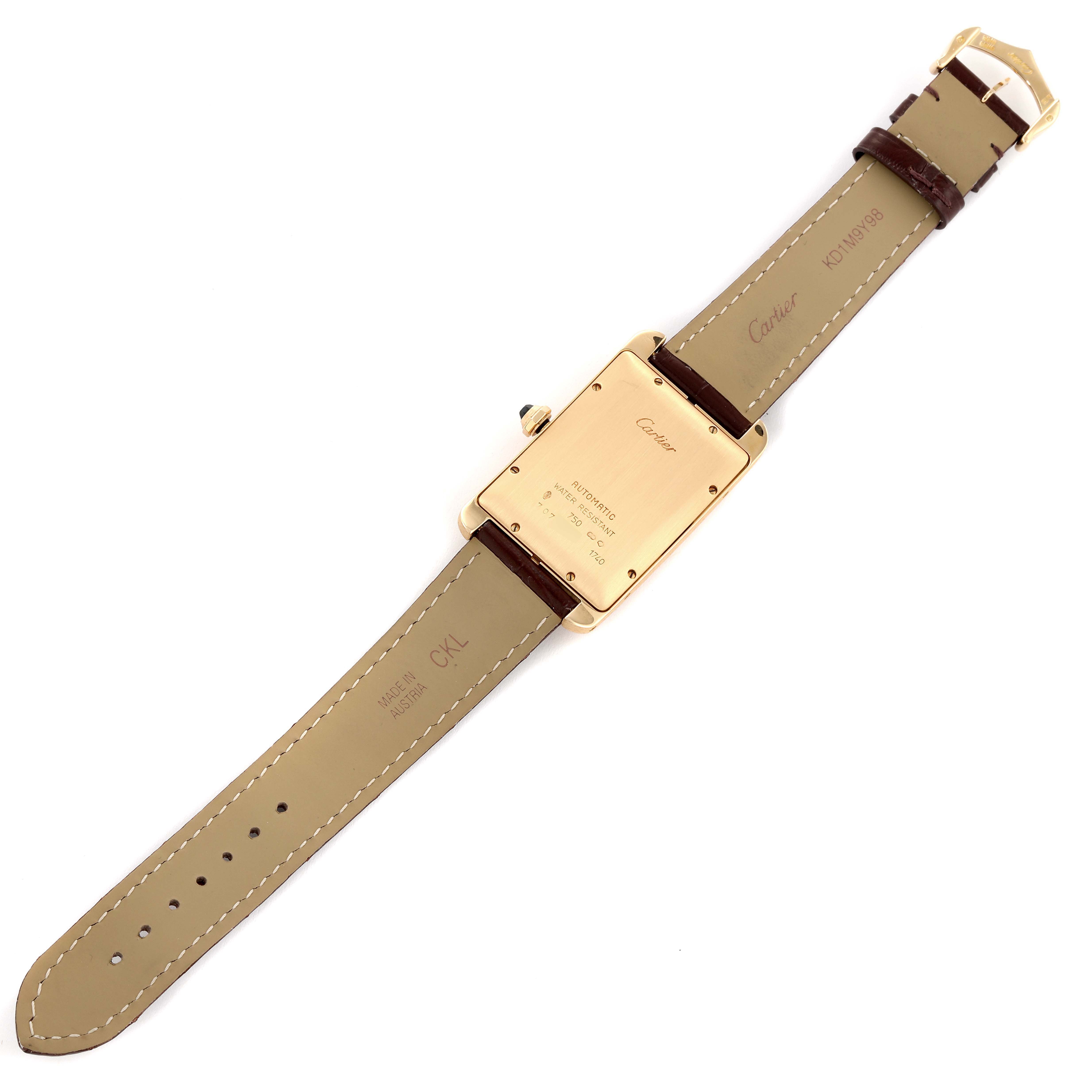The image shows the back view of a Cartier Tank Americaine W2603156 Men's Yellow Gold Silver Dial W2603156 Men's Yellow Gold Silver Dial watch, displaying the case back, leather straps, and buckle.