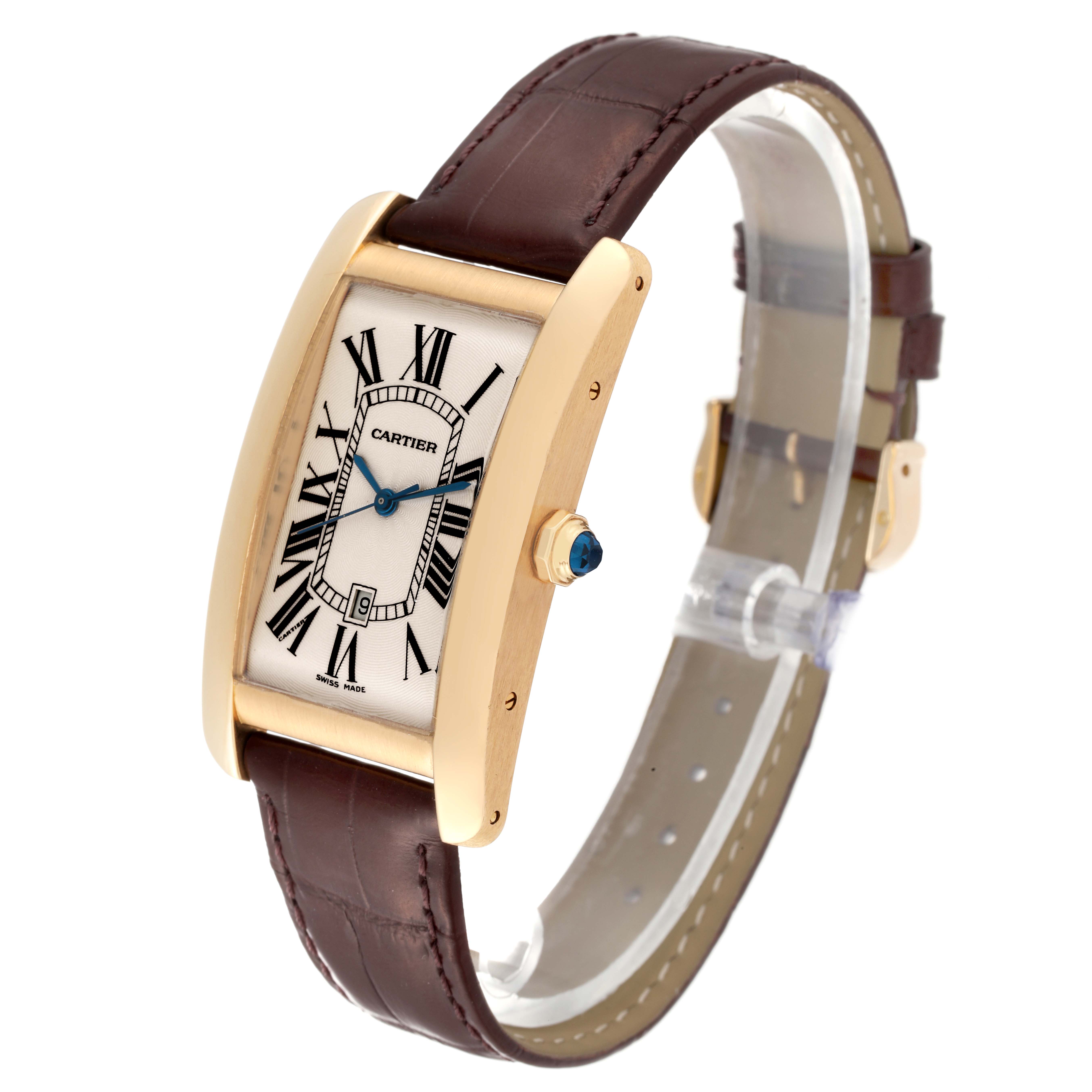 The Cartier Tank Americaine W2603156 Men's Yellow Gold Silver Dial W2603156 Men's Yellow Gold Silver Dial watch is shown from a three-quarter angle, highlighting its rectangular face, gold casing, and brown leather strap.