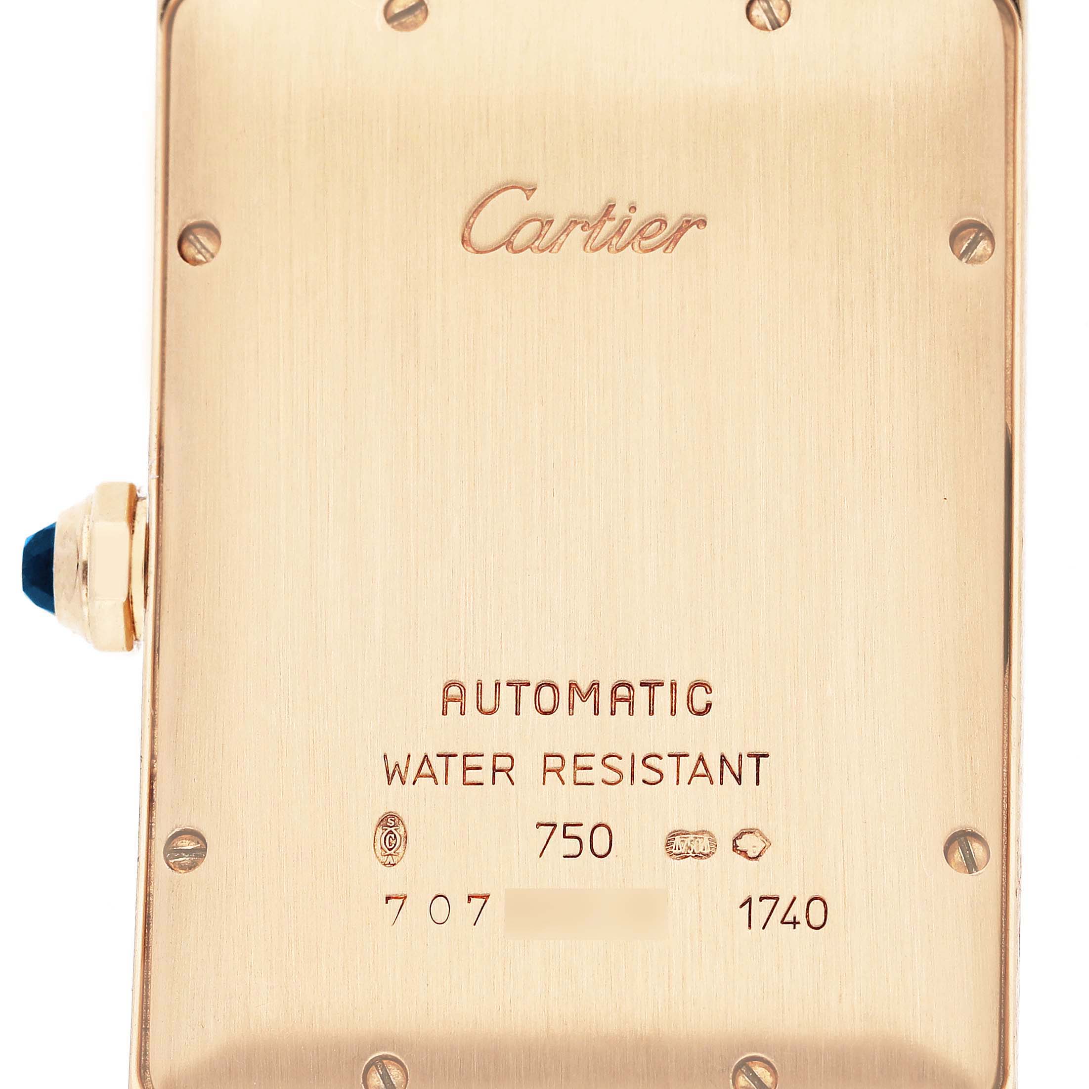 The image shows the back casing and crown of the Cartier Tank Américaine watch.