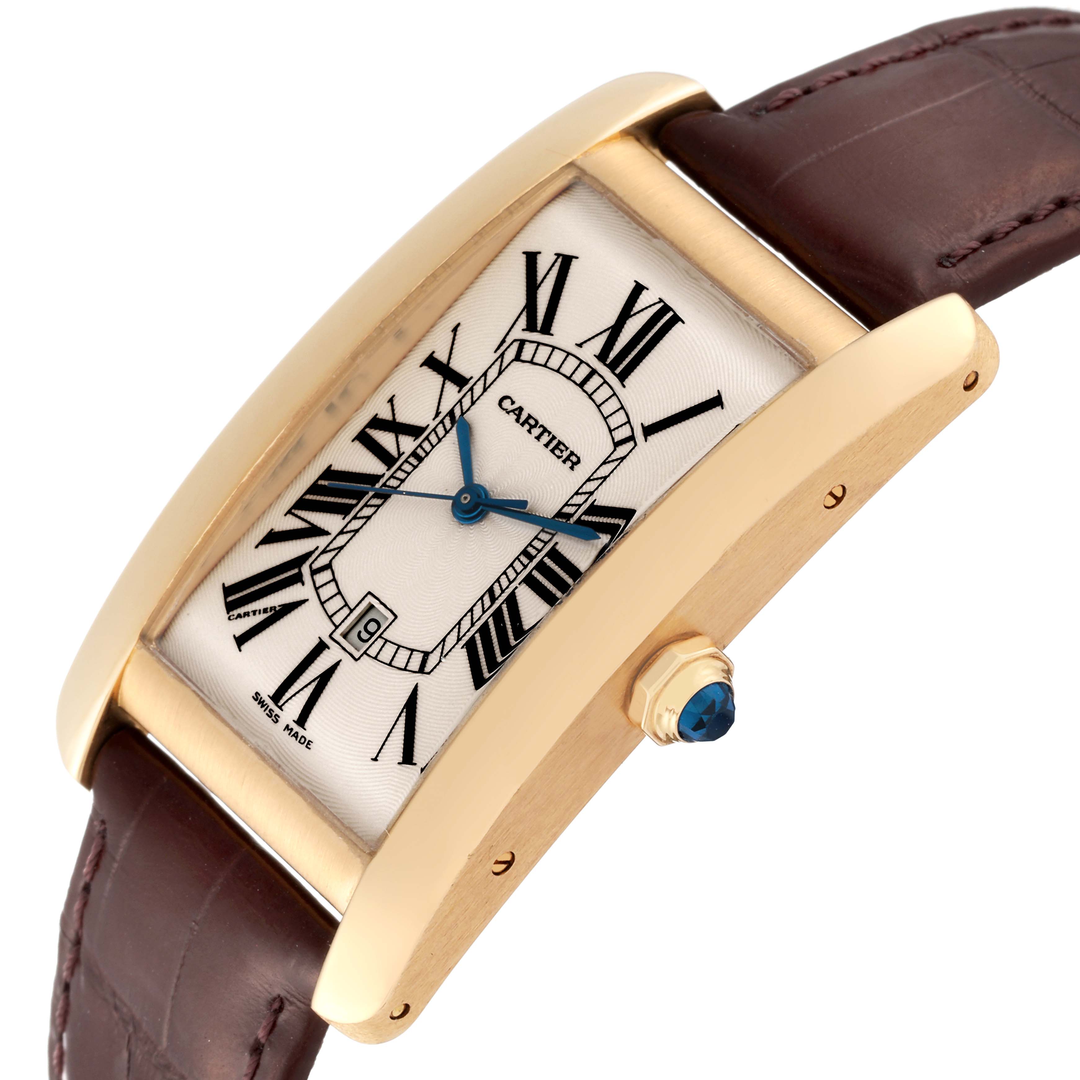 This image shows a Cartier Tank Americaine W2603156 Men's Yellow Gold Silver Dial W2603156 Men's Yellow Gold Silver Dial watch angled to display its face, gold casing, and brown leather strap.