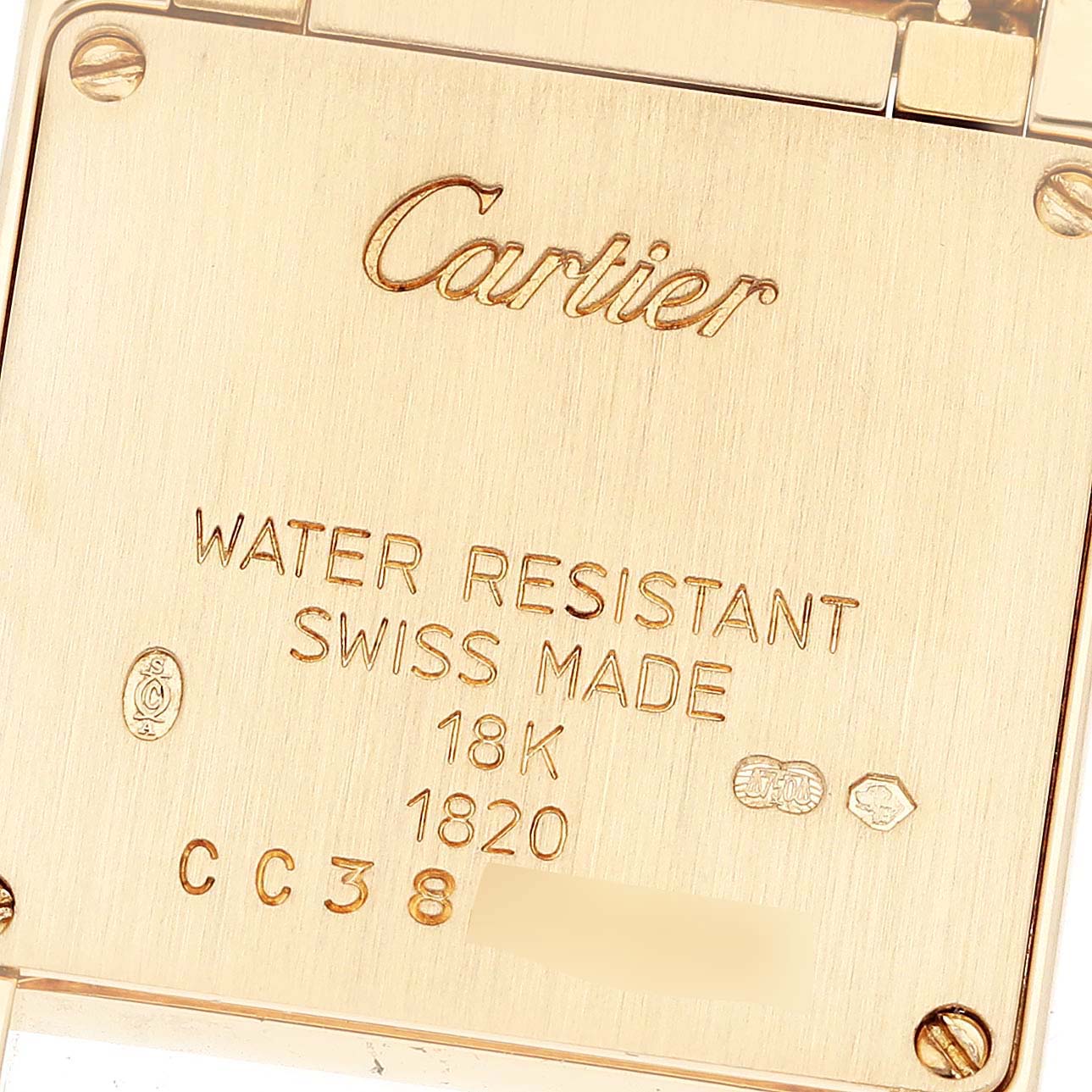 This is a close-up view of the back plate of a Cartier Tank Française watch.