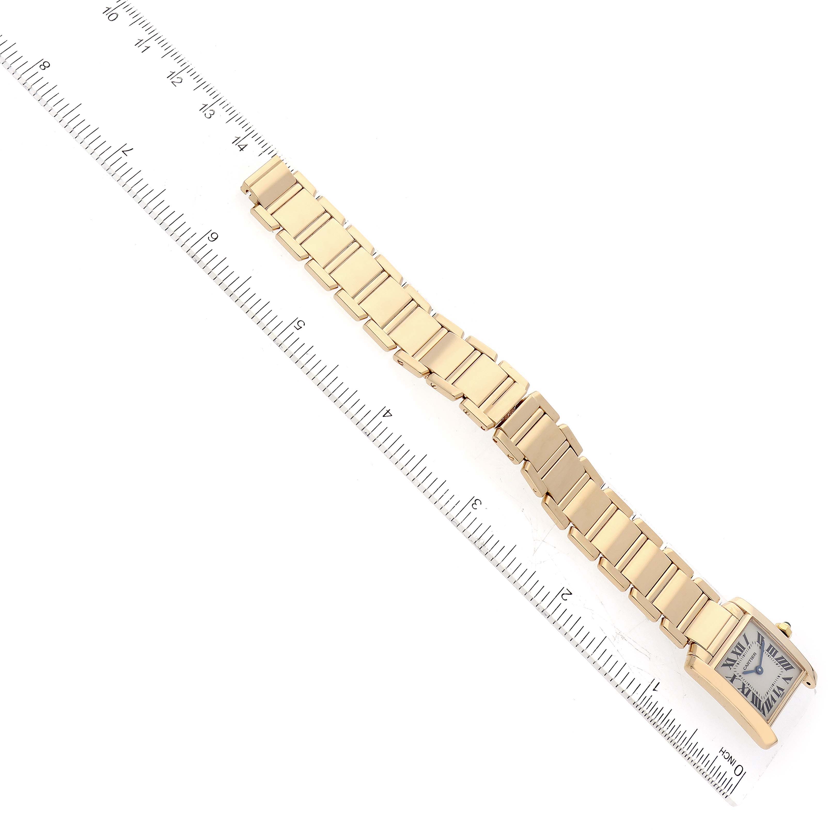 The image shows a Cartier Tank Francaise W50002N2 Women
s Yellow Gold Silver Dial W50002N2 Women
s Yellow Gold Silver Dial watch laid flat, measured with a ruler, displaying the face and gold link bracelet.