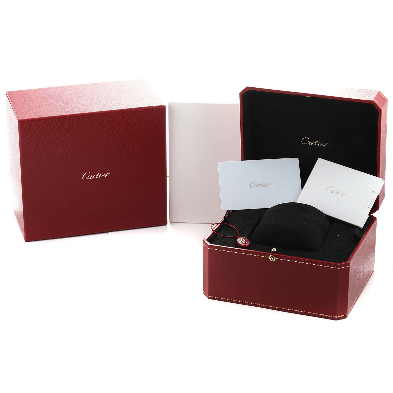 The image shows a Cartier Tank Must WSTA0108 Women's Stainless Steel Black Dial box at an angle, featuring the outer box, inner case, and documentation.