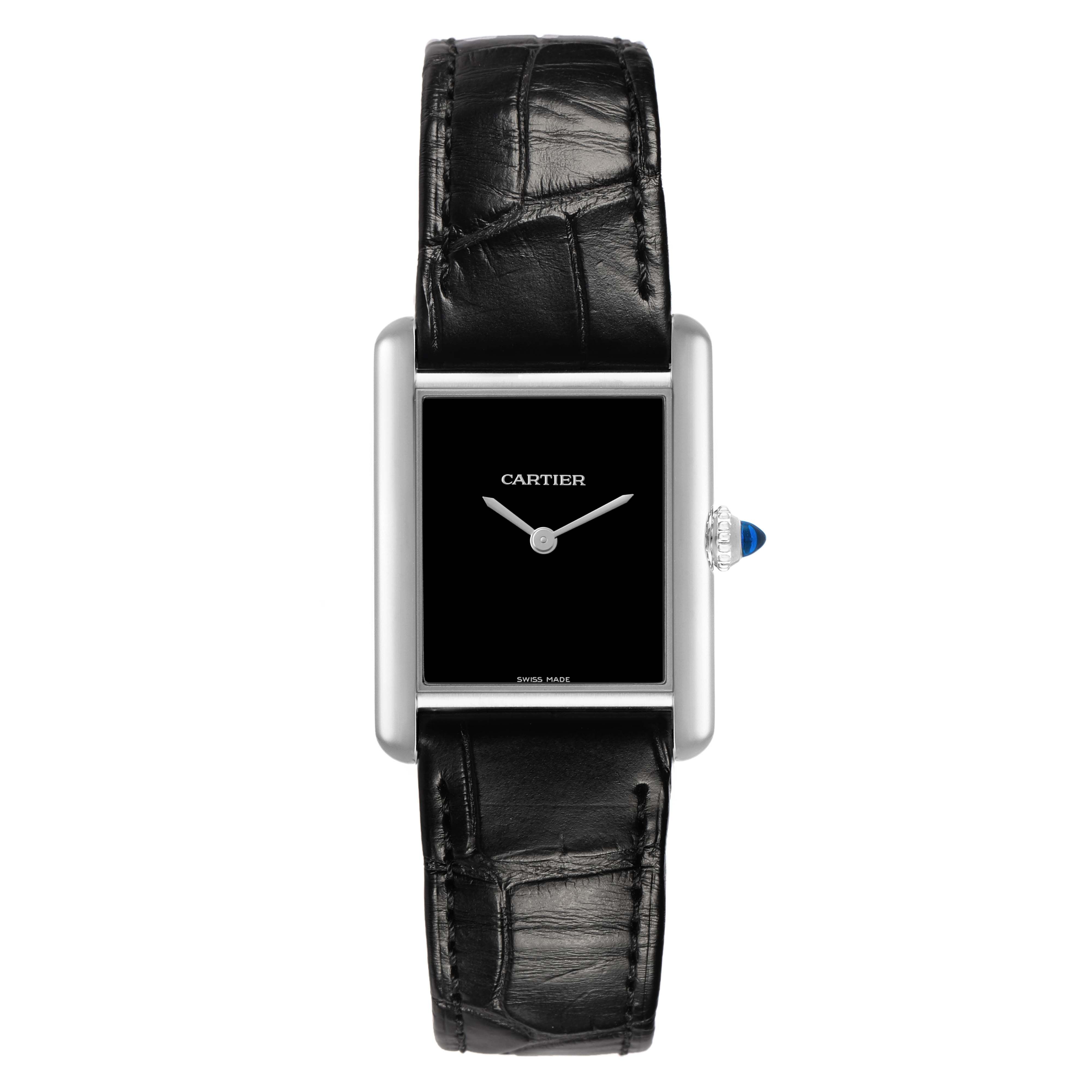 The Cartier Tank Must WSTA0108 Women's Stainless Steel Black Dial watch is shown from the front, displaying the rectangular dial, black leather strap, and blue cabochon crown.