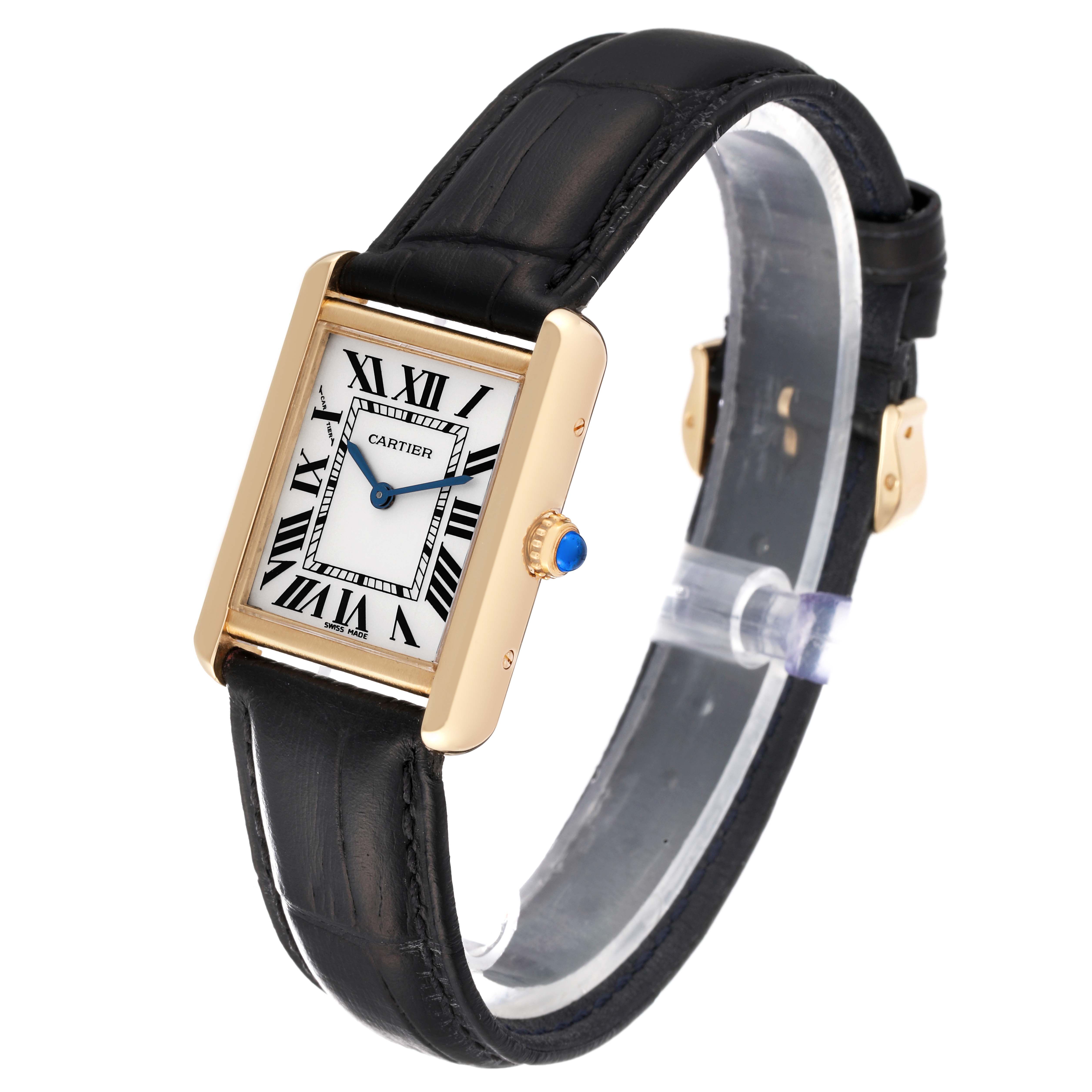 The image shows a Cartier Tank Solo W1018755 Women
s Steel and Gold (two tone) Silver Dial W1018755 Women
s Steel and Gold (two tone) Silver Dial watch at an angle highlighting its rectangular face, Roman numeral dial, black leather strap, and gold casing.