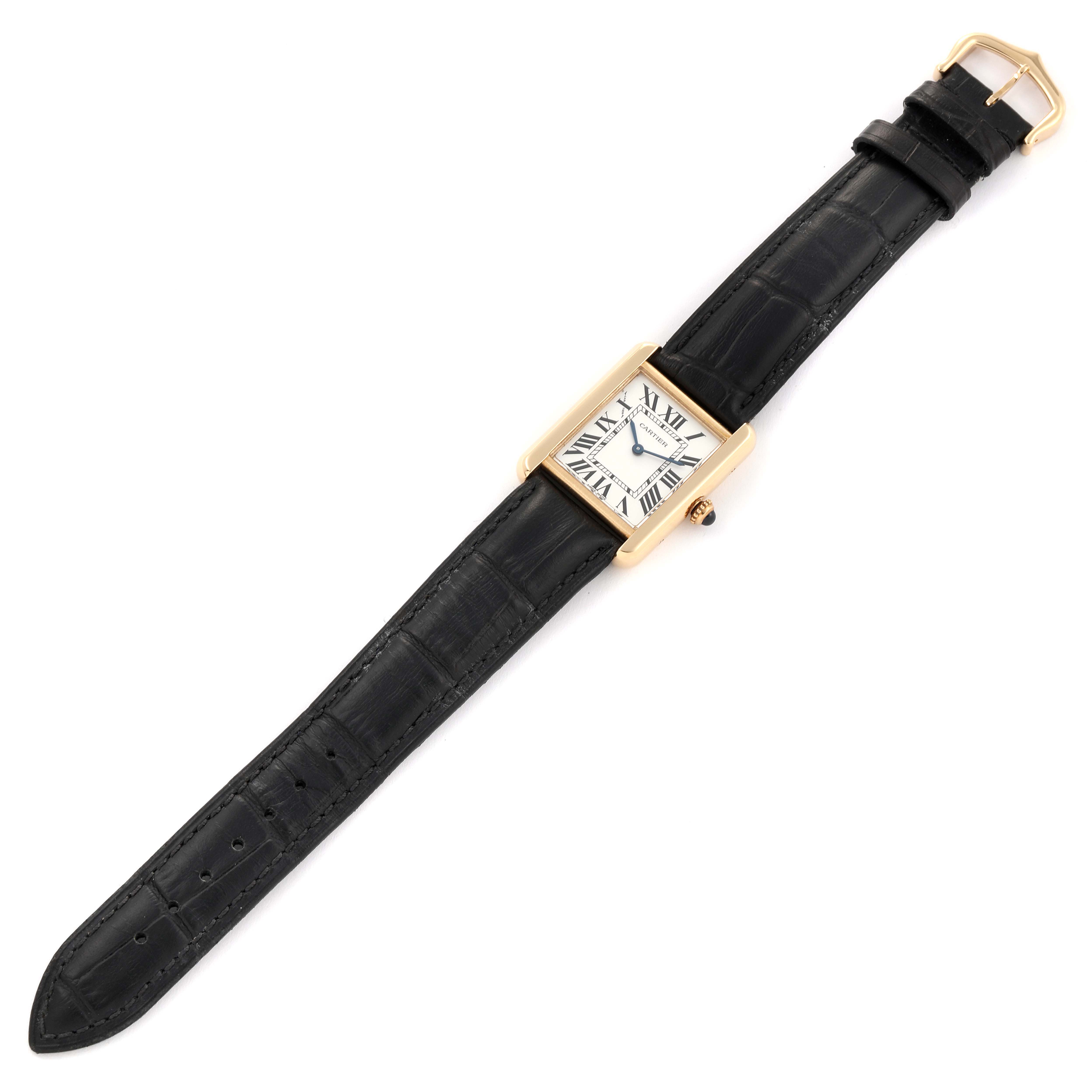 The Cartier Tank Solo W1018755 Women
s Steel and Gold (two tone) Silver Dial W1018755 Women
s Steel and Gold (two tone) Silver Dial watch is shown from a top-down angle, displaying the face, black leather strap, and gold-tone case.