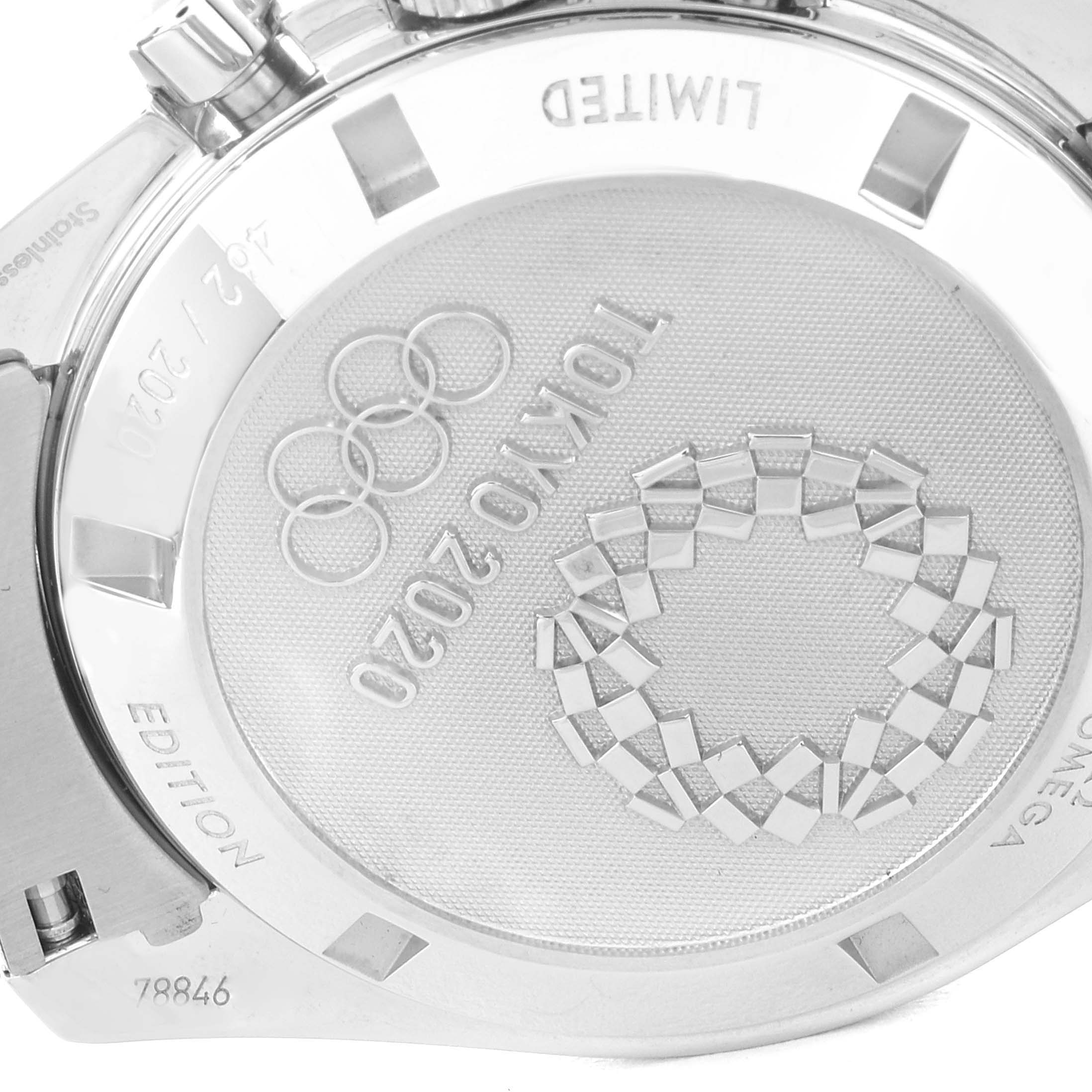 The image shows the back case of an Omega Speedmaster 522.30.42.30.06.001 Men's Stainless Steel Silver Dial 522.30.42.30.06.001 Men's Stainless Steel Silver Dial watch, featuring an engraving for the Tokyo 2020 Olympics.