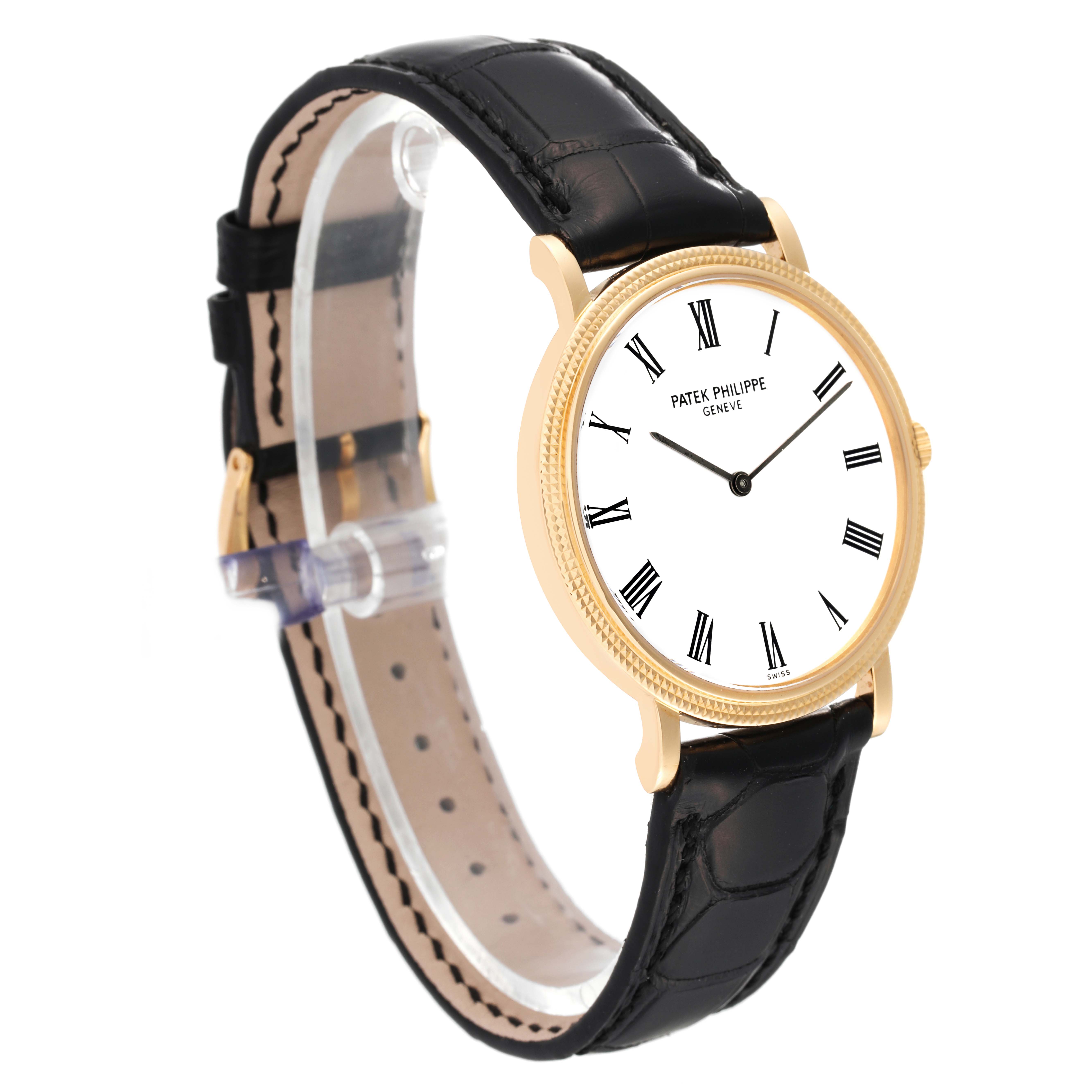 This image shows a Patek Philippe Calatrava 5120J Men's Yellow Gold White Dial 5120J Men's Yellow Gold White Dial watch, angled to display the watch face and leather strap.