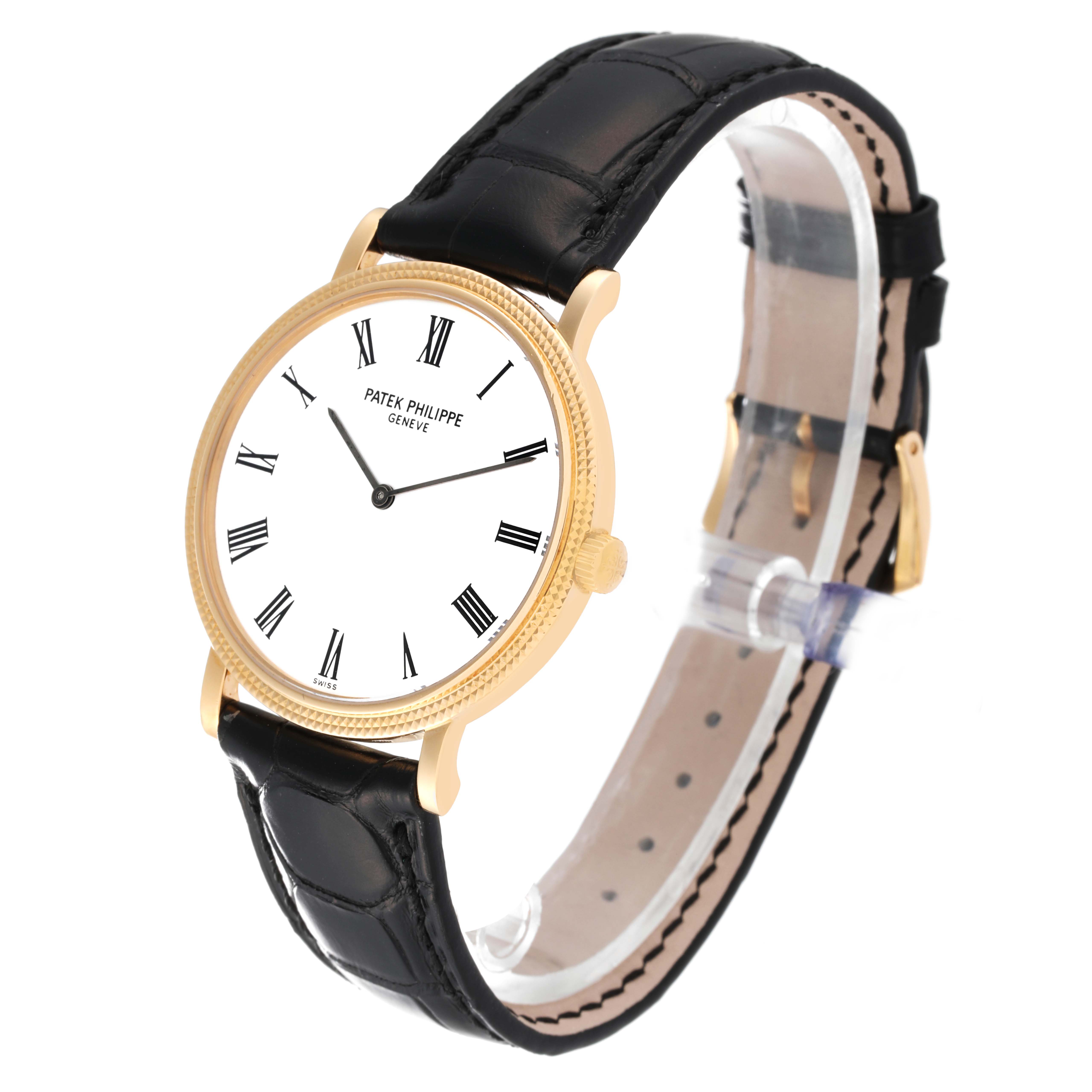 The image shows a side-front angle of the Patek Philippe Calatrava 5120J Men's Yellow Gold White Dial 5120J Men's Yellow Gold White Dial watch, displaying the watch face, strap, and buckle.