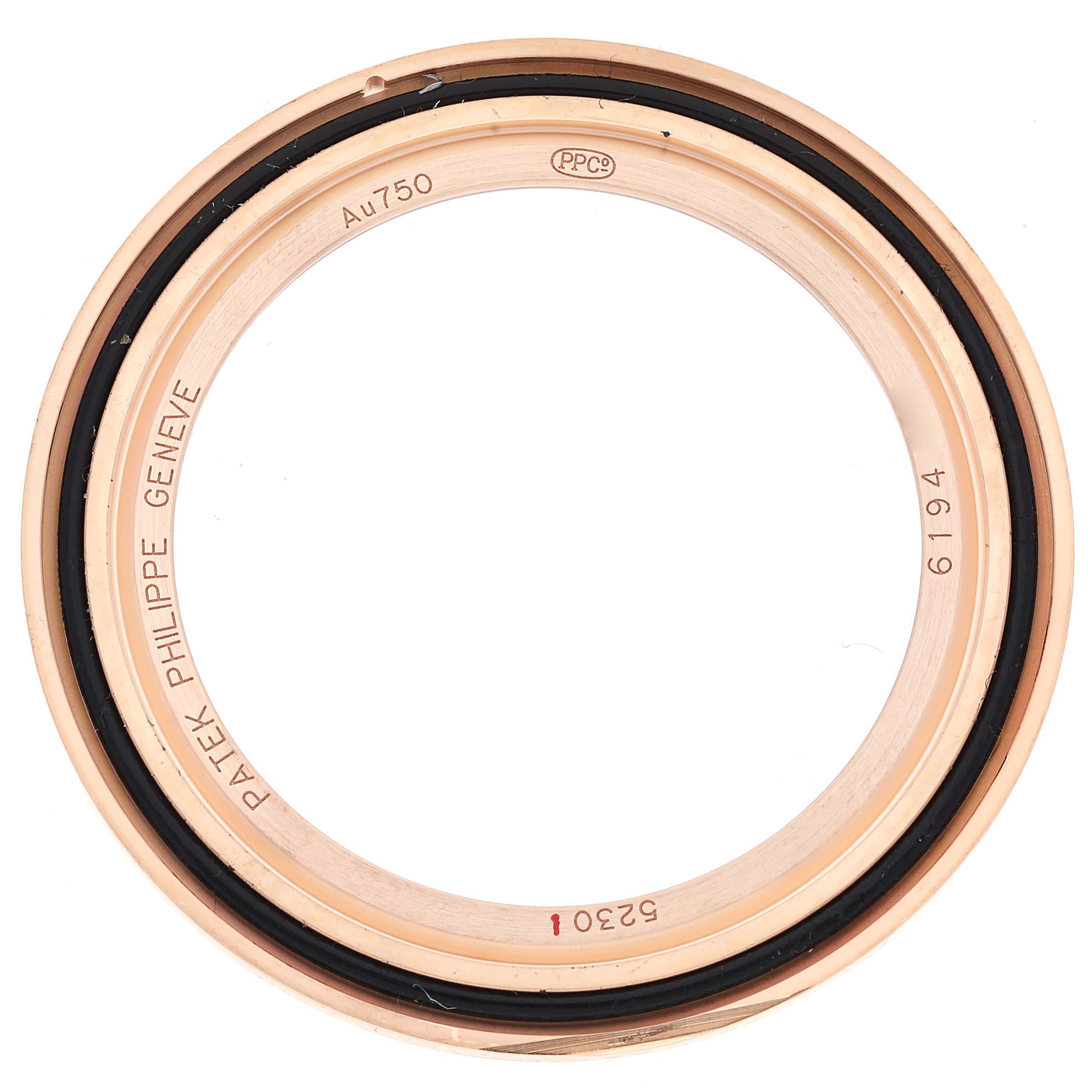 The image shows the bezel of a Patek Philippe Complications 5230R Men's Rose Gold Grey Dial 5230R Men's Rose Gold Grey Dial model watch from a top-down view.