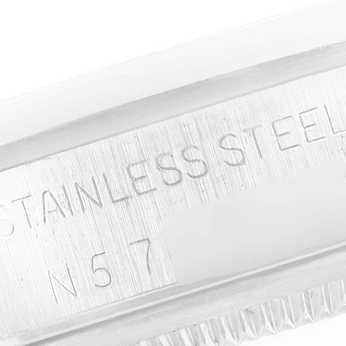 This image shows an engraving on the side of the case of a Rolex Air-King 14000 Men's Stainless Steel Black Dial 14000 Men's Stainless Steel Black Dial watch, indicating it's made of stainless steel.
