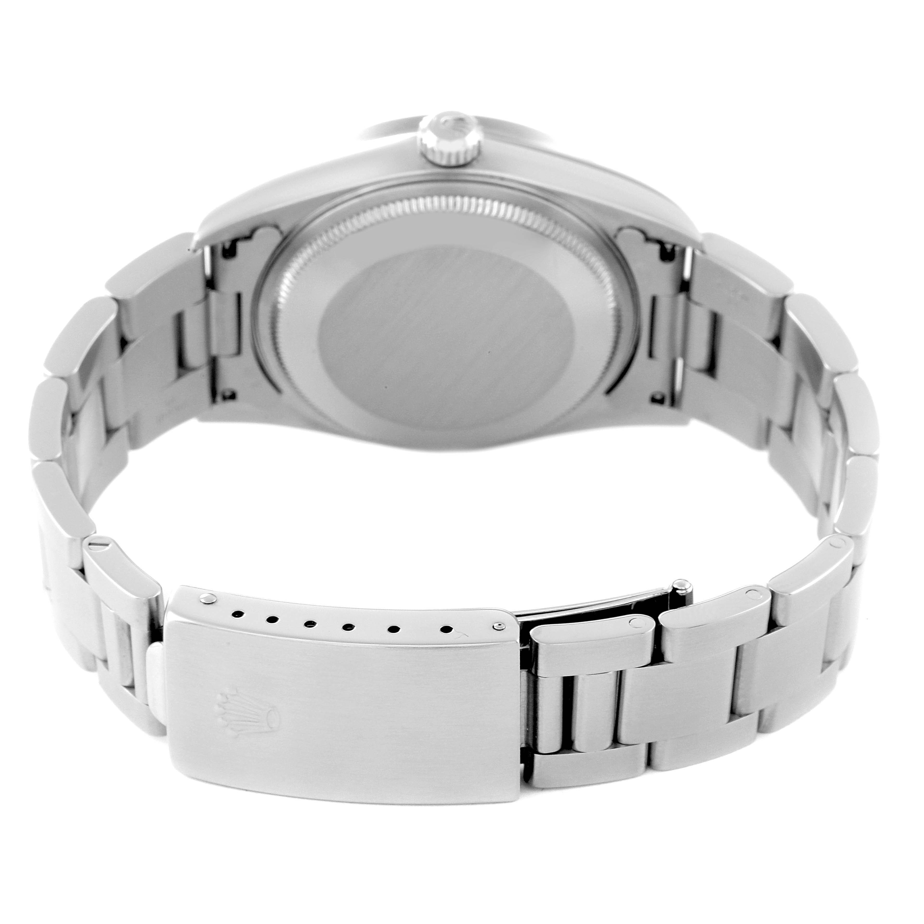 The image shows the backside of the Rolex Air-King 14010 Men's Stainless Steel Blue Dial 14010 Men's Stainless Steel Blue Dial watch, focusing on the case back and the bracelet clasp.