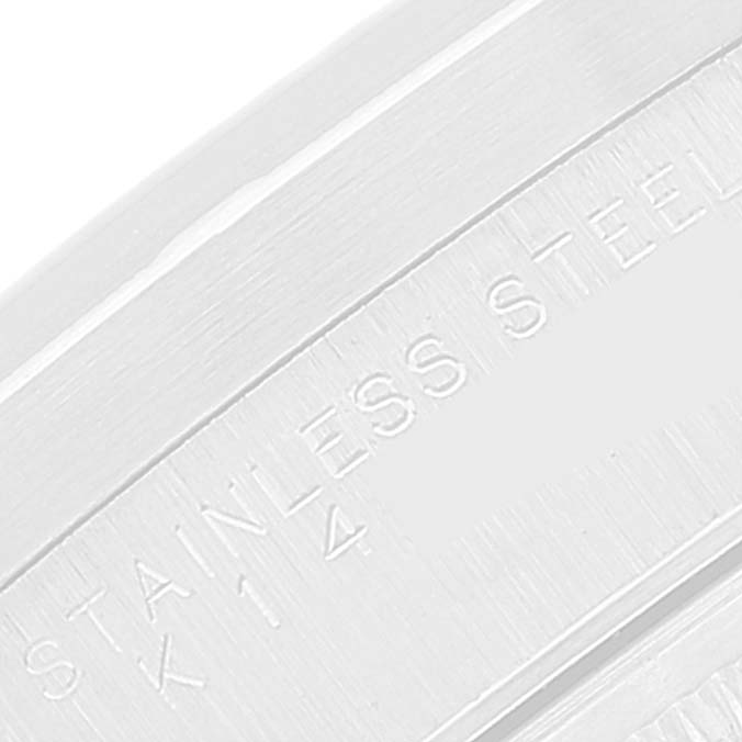 The image shows an extreme close-up of the engraved text on the stainless steel casing of the Rolex Air-King 14010 Men's Stainless Steel Blue Dial 14010 Men's Stainless Steel Blue Dial watch.