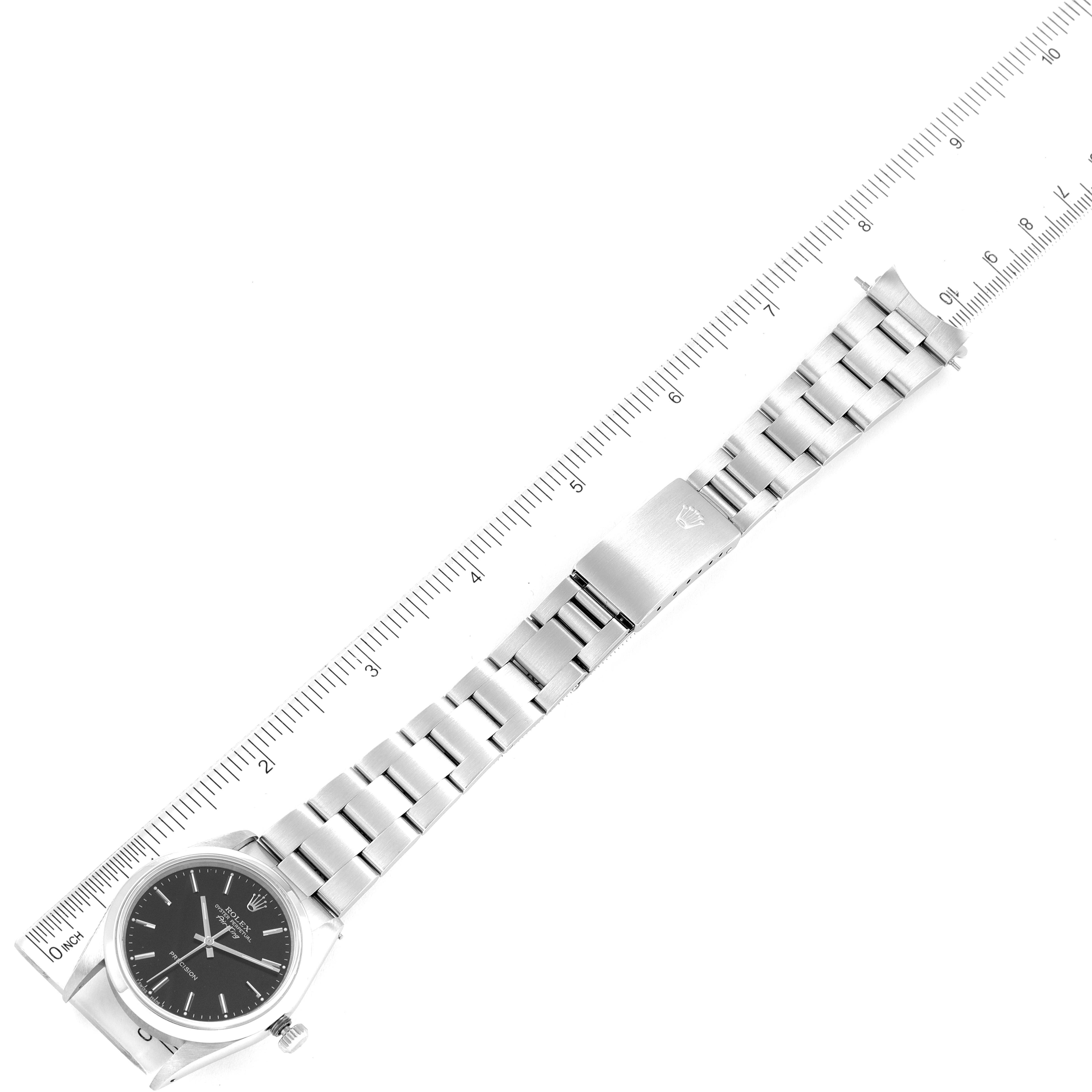 The image shows a Rolex Air-King 14000 Men's Stainless Steel Black Dial 14000 Men's Stainless Steel Black Dial watch laid flat with the entire bracelet and clasp visible, alongside a measuring ruler.