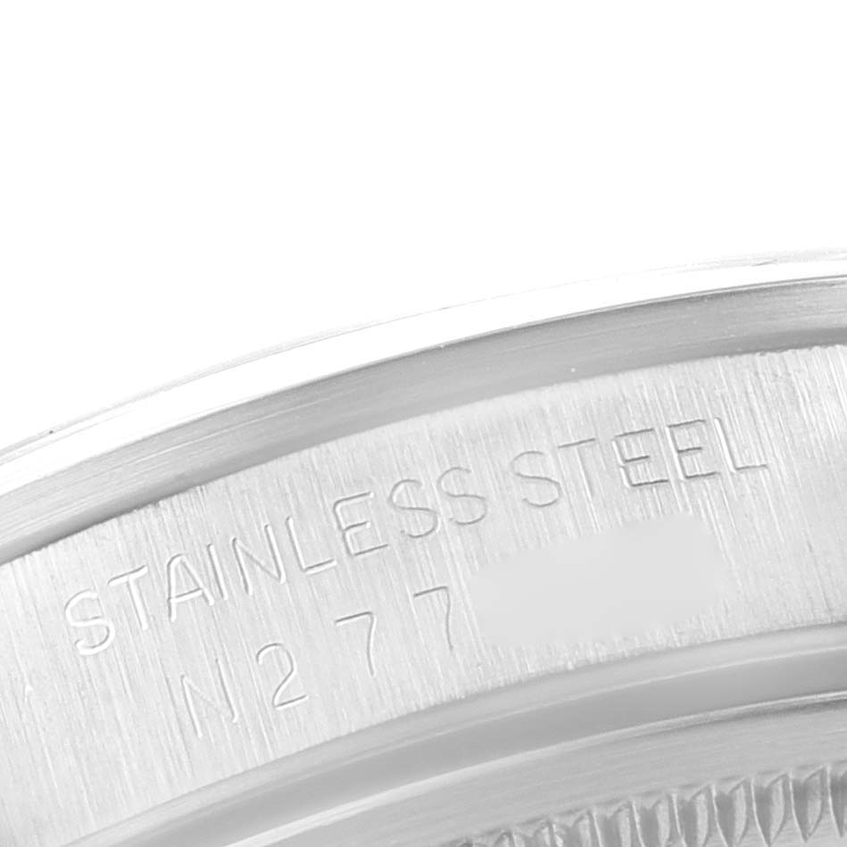 This close-up image shows the engraving on the stainless steel case back of a Rolex Air-King 14000 Men's Stainless Steel Black Dial 14000 Men's Stainless Steel Black Dial watch.