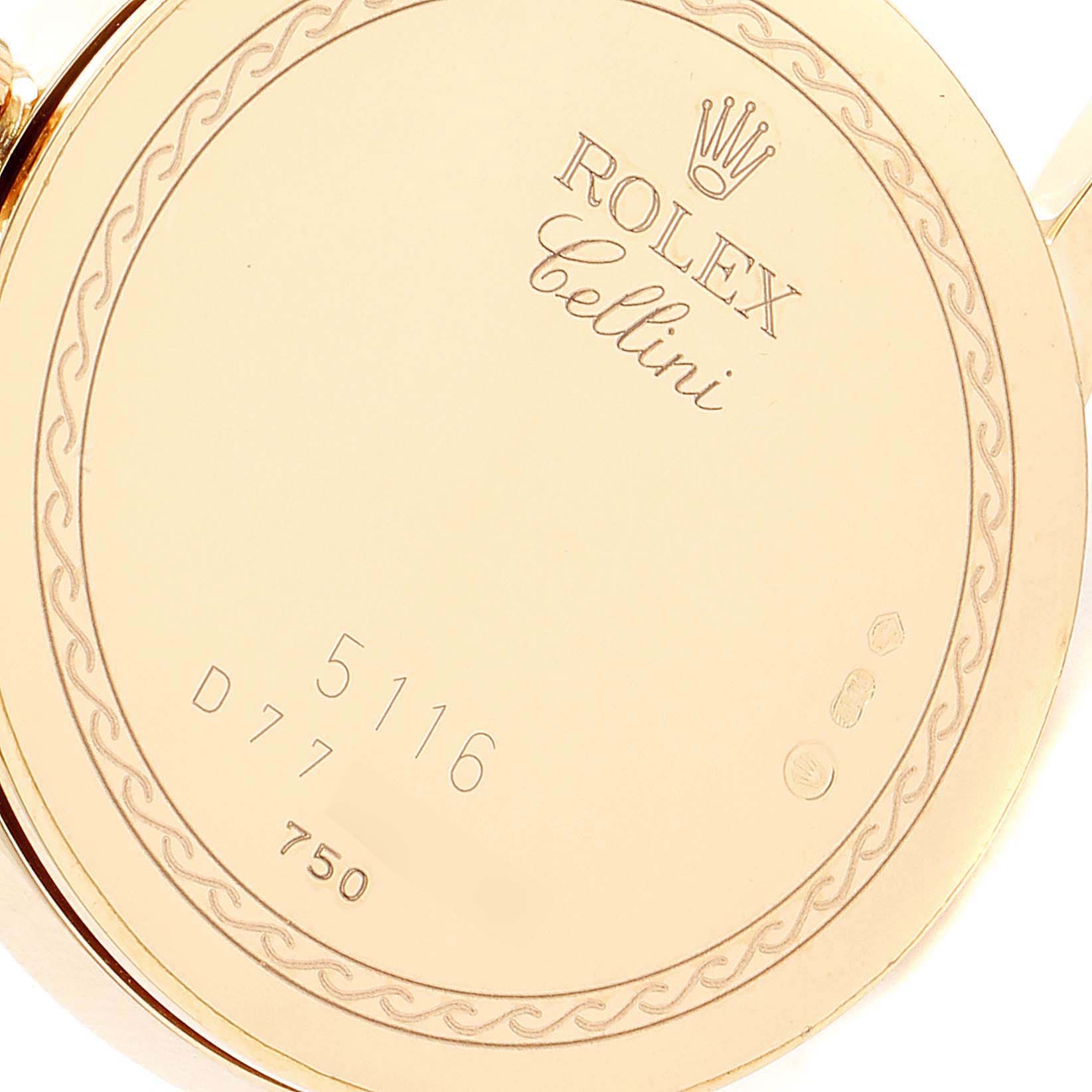 The image shows the back case of a Rolex Cellini 5116 Men's Yellow Gold Champagne Dial 5116 Men's Yellow Gold Champagne Dial watch, featuring the engraved brand name and serial numbers.