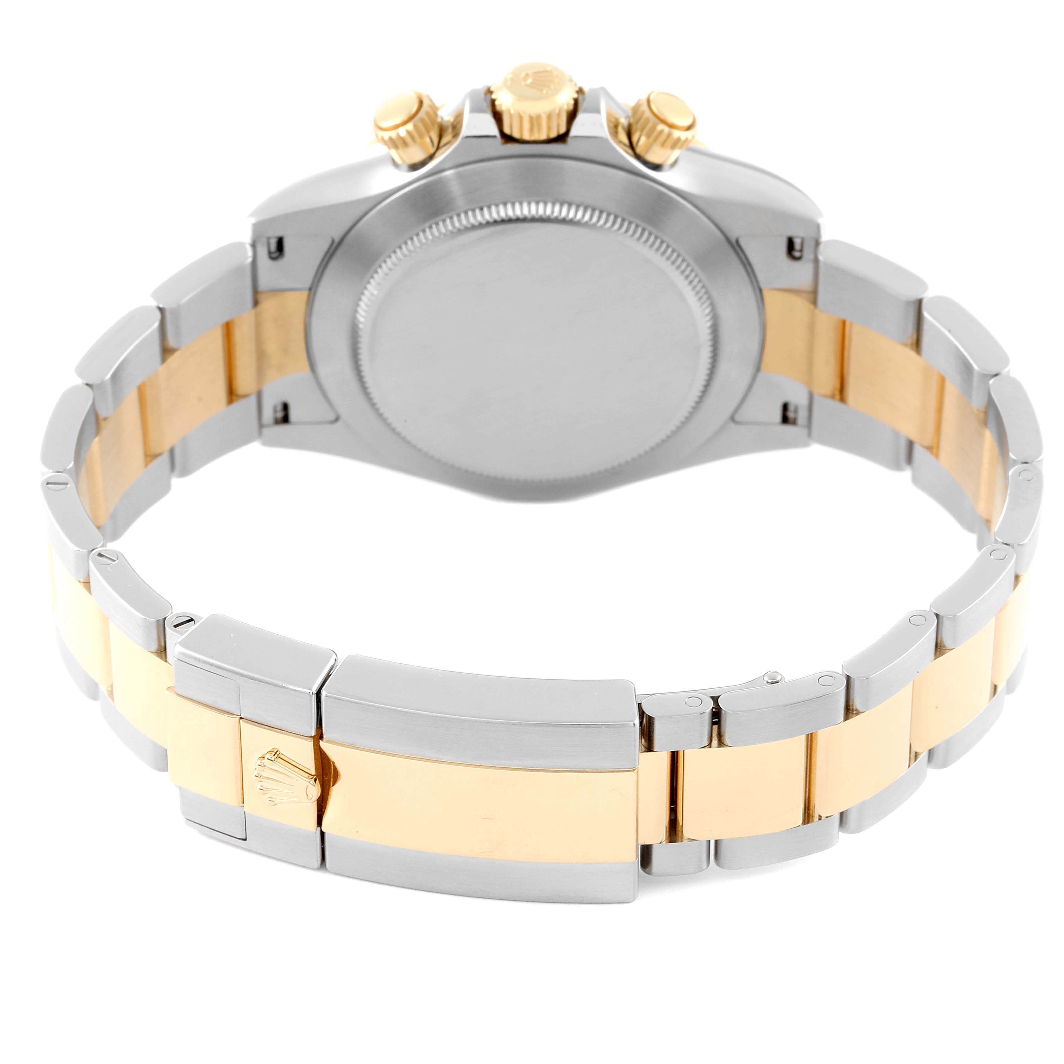 This image shows the back view of a Rolex Daytona 116503 Men's Steel and Gold (two tone) White Dial 116503 Men's Steel and Gold (two tone) White Dial watch with a two-tone metal bracelet and clasp.