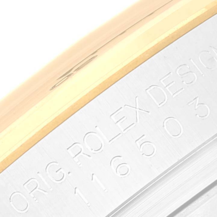 The image shows a close-up of the side of a Rolex Daytona 116503 Men's Steel and Gold (two tone) White Dial 116503 Men's Steel and Gold (two tone) White Dial watch, highlighting the engraved text and two-tone bezel.