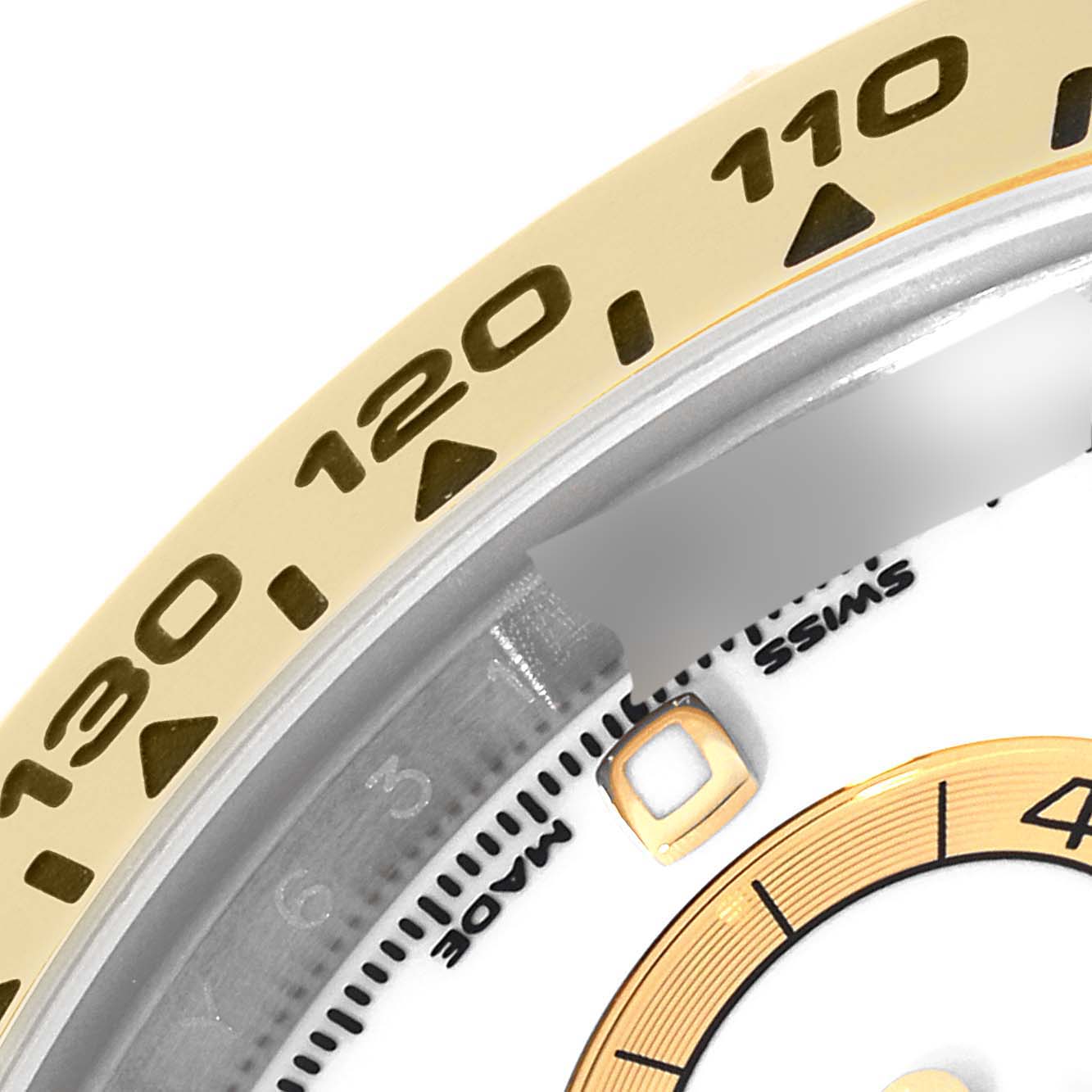 The image shows a close-up of the bezel and partial dial of a Rolex Daytona 116503 Men's Steel and Gold (two tone) White Dial 116503 Men's Steel and Gold (two tone) White Dial watch, highlighting the tachymeter scale.