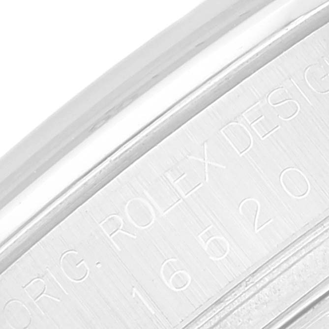 The image shows a close-up of the engraved side of a Rolex Daytona 16520 Men's Stainless Steel Black Dial 16520 Men's Stainless Steel Black Dial watch case, highlighting the model number.