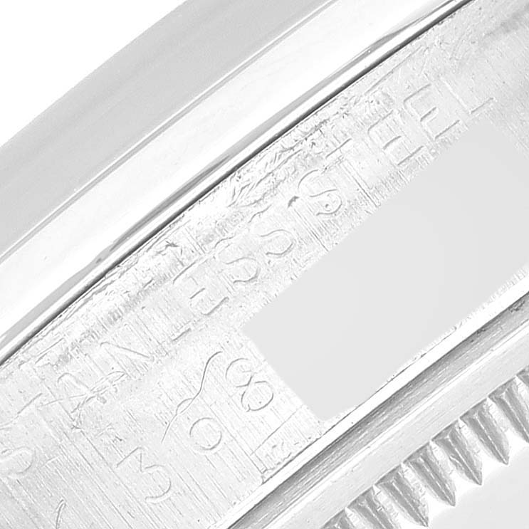 This image shows a close-up angle of the stainless steel casing with engraved text of a Vintage Collection model by Rolex.