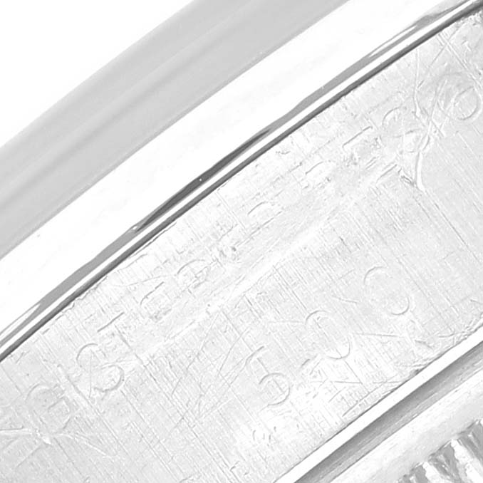 This close-up image shows the etched markings on the edge of the case of a Rolex Vintage Collection 1500 Men's Stainless Steel Brown Dial 1500 Men's Stainless Steel Brown Dial watch.