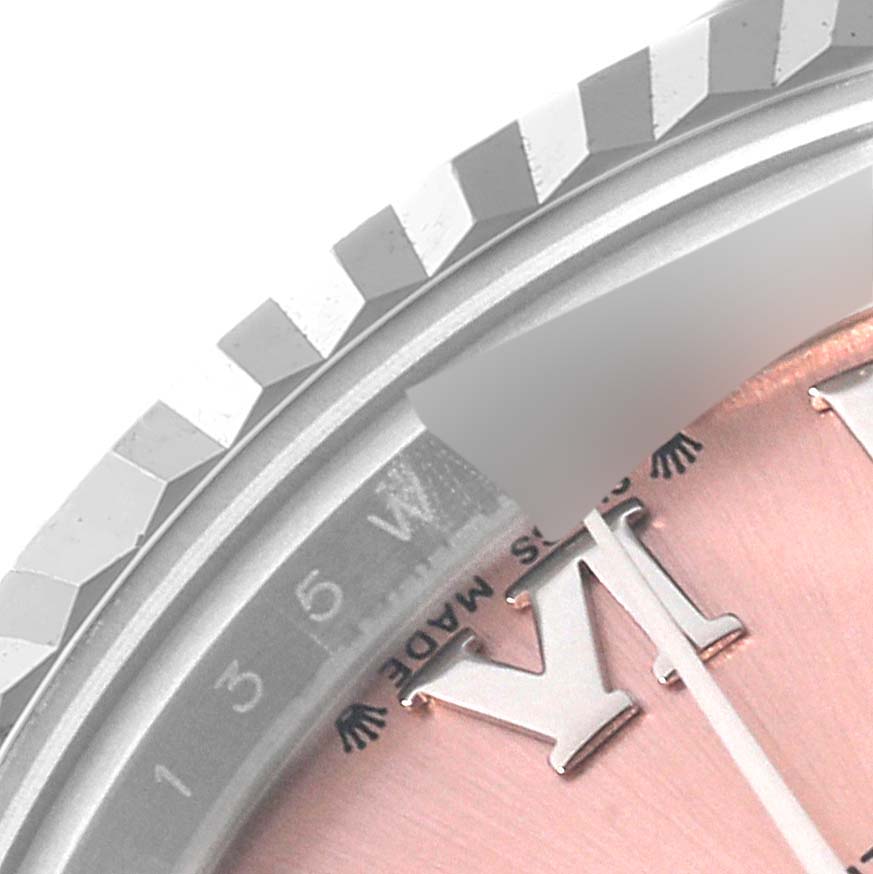 This image shows a close-up of the dial and partially the bezel of the Rolex Datejust 279174 Women's Stainless Steel Pink Dial 279174 Women's Stainless Steel Pink Dial watch.