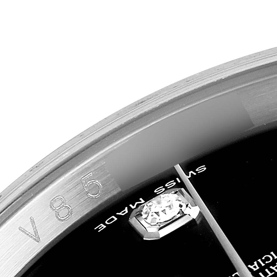 The image shows a close-up angle of the Rolex Datejust 116244 Men's Stainless Steel Black Dial 116244 Men's Stainless Steel Black Dial watch, highlighting part of the bezel and the "SWISS MADE" text on the dial.