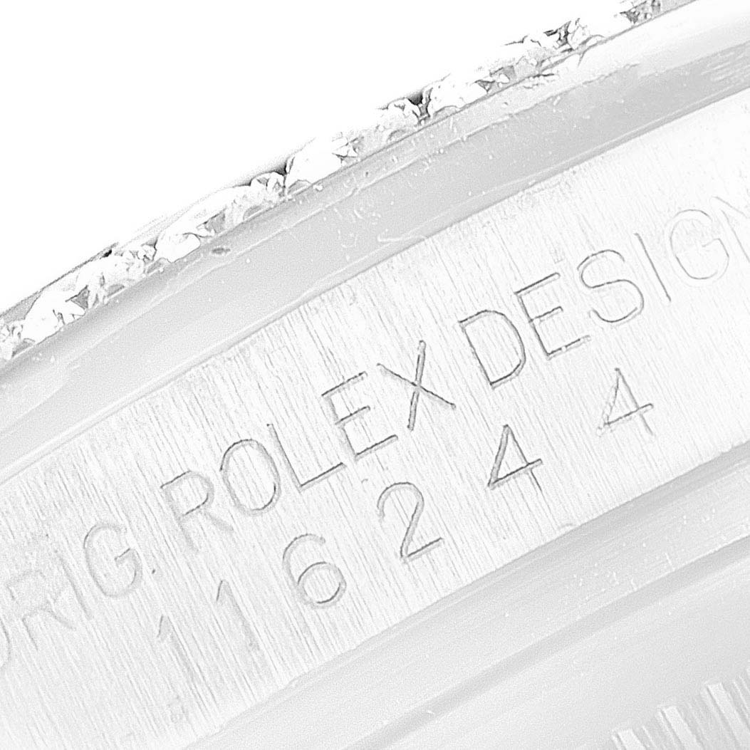 This image shows a close-up of the engraved serial number on the case of a Rolex Datejust 116244 Men's Stainless Steel Black Dial 116244 Men's Stainless Steel Black Dial watch.