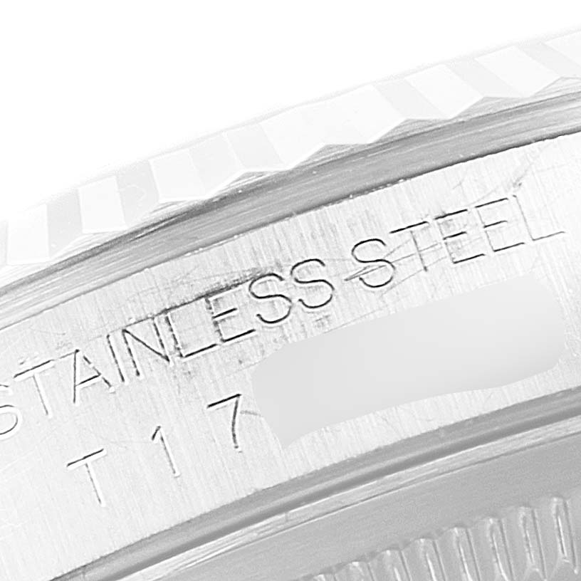 The image shows a close-up view of the side of a Rolex Datejust 16234 Men
s Stainless Steel Black Dial 16234 Men
s Stainless Steel Black Dial watch focusing on the engraved text "STAINLESS STEEL."
