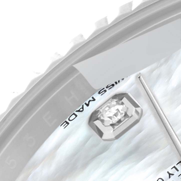 The image shows a close-up of the dial of the Rolex Datejust 41 126334 Men
s Stainless Steel Mother of Pearl Dial 126334 Men
s Stainless Steel Mother of Pearl Dial, highlighting the diamond marker, part of the bezel, and minute hand.