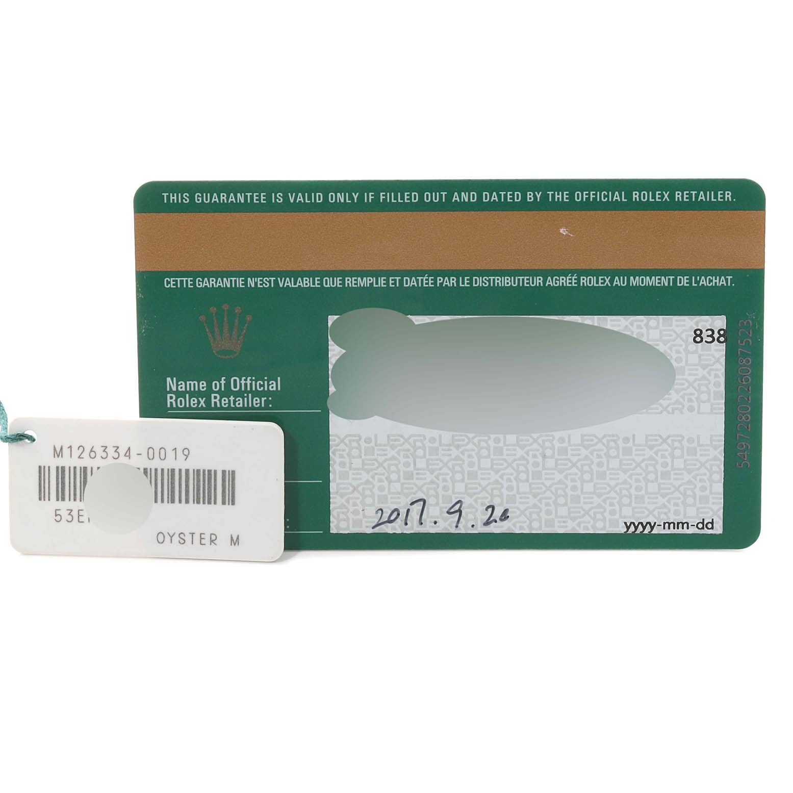 The image shows the warranty card and tag for a Rolex Datejust 41 126334 Men
s Stainless Steel Mother of Pearl Dial 126334 Men
s Stainless Steel Mother of Pearl Dial model, viewed from above.