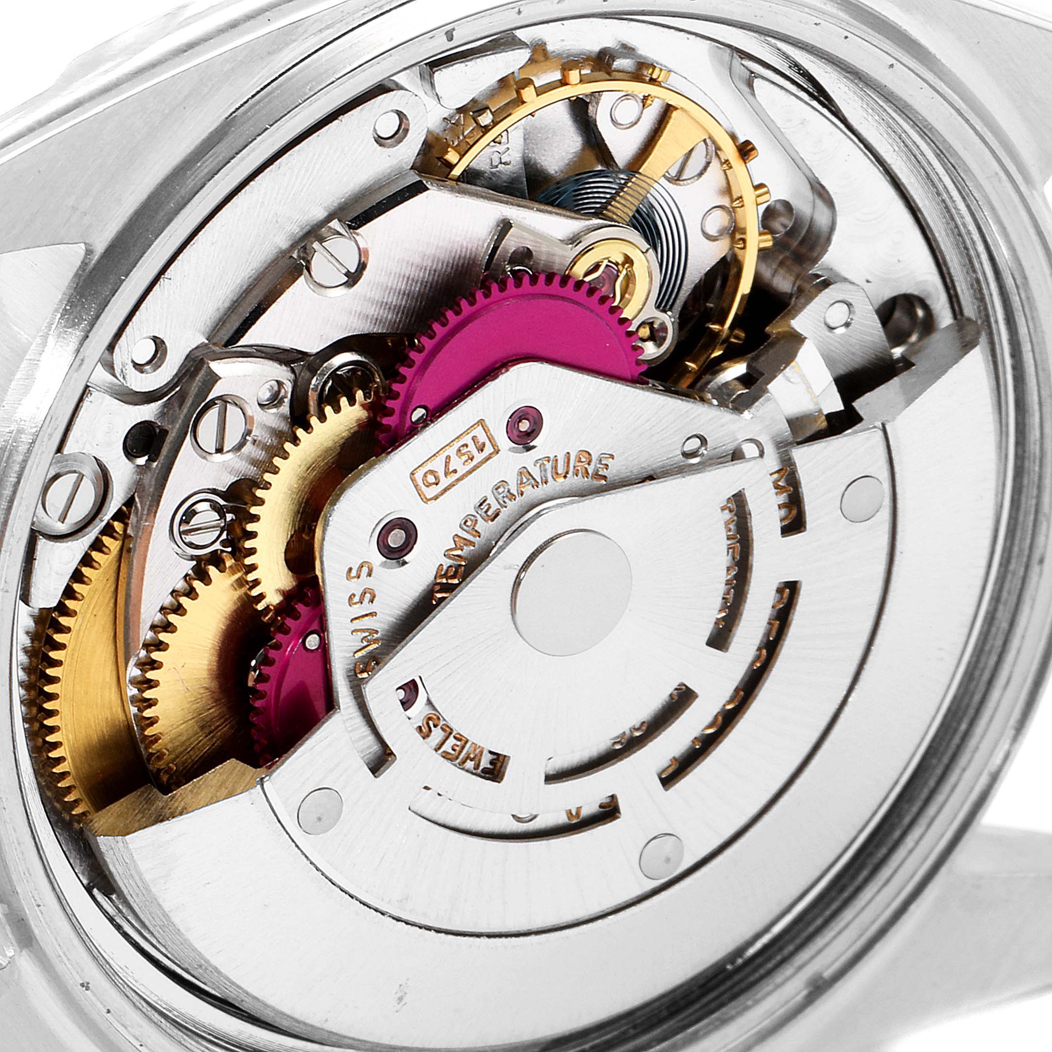 The image shows the Rolex Vintage Collection 1601 Men's Steel and Gold (two tone) Black Dial 1601 Men's Steel and Gold (two tone) Black Dial model's intricate internal movement mechanism from a close-up angle.