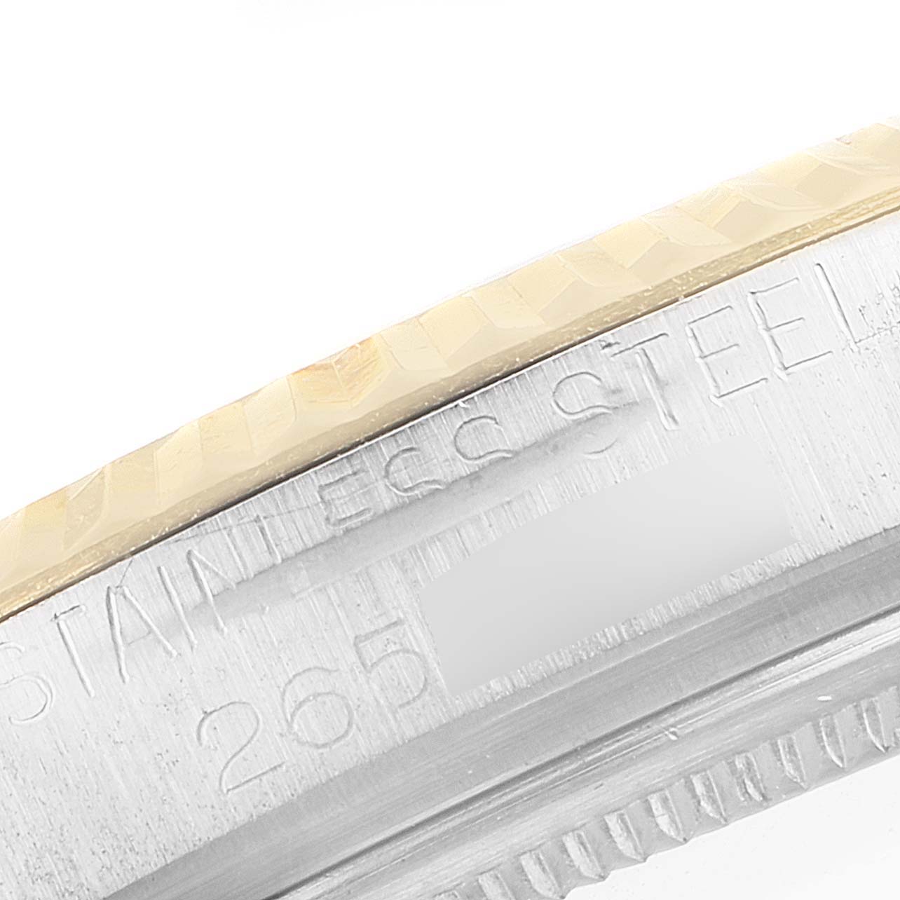 This image shows a close-up angle of the side of the casing and bezel of a Rolex Vintage Collection 1601 Men's Steel and Gold (two tone) Black Dial 1601 Men's Steel and Gold (two tone) Black Dial model.