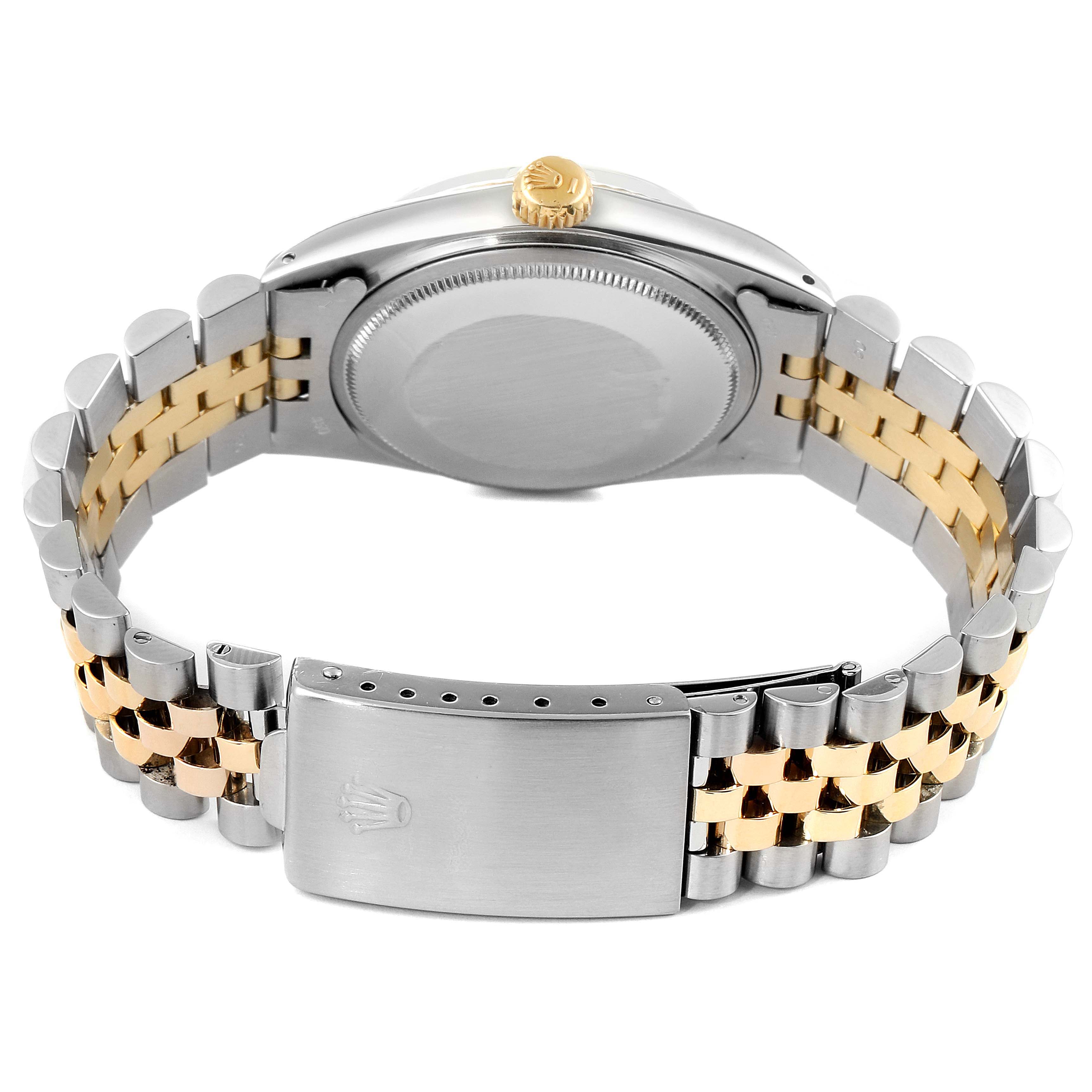 This image shows the back case, crown, and two-tone bracelet of the Rolex Vintage Collection 1601 Men's Steel and Gold (two tone) Black Dial 1601 Men's Steel and Gold (two tone) Black Dial model.