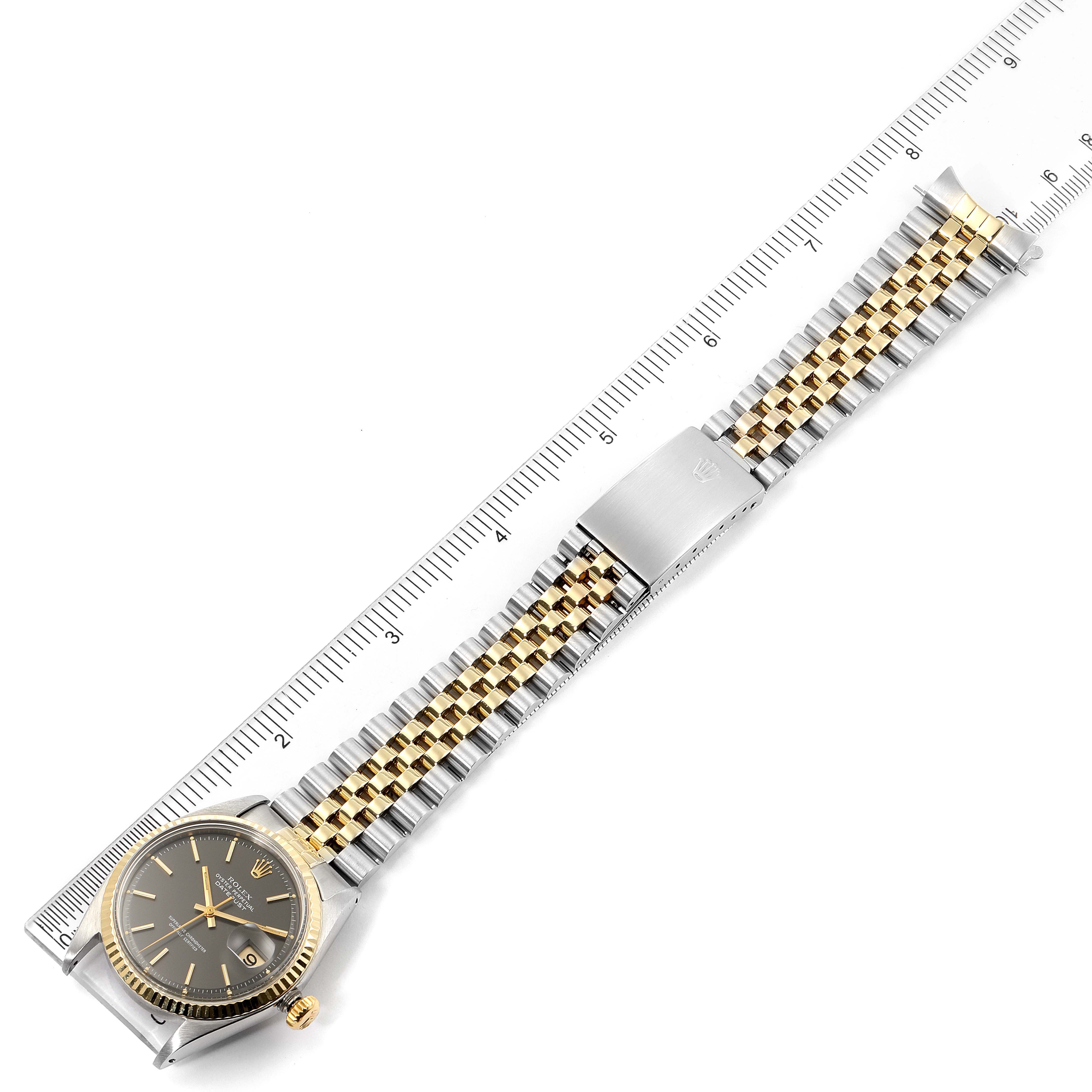 The image shows a top-down view of the Rolex Vintage Collection 1601 Men's Steel and Gold (two tone) Black Dial 1601 Men's Steel and Gold (two tone) Black Dial model watch, highlighting the watch face, bezel, crown, and entire bracelet.