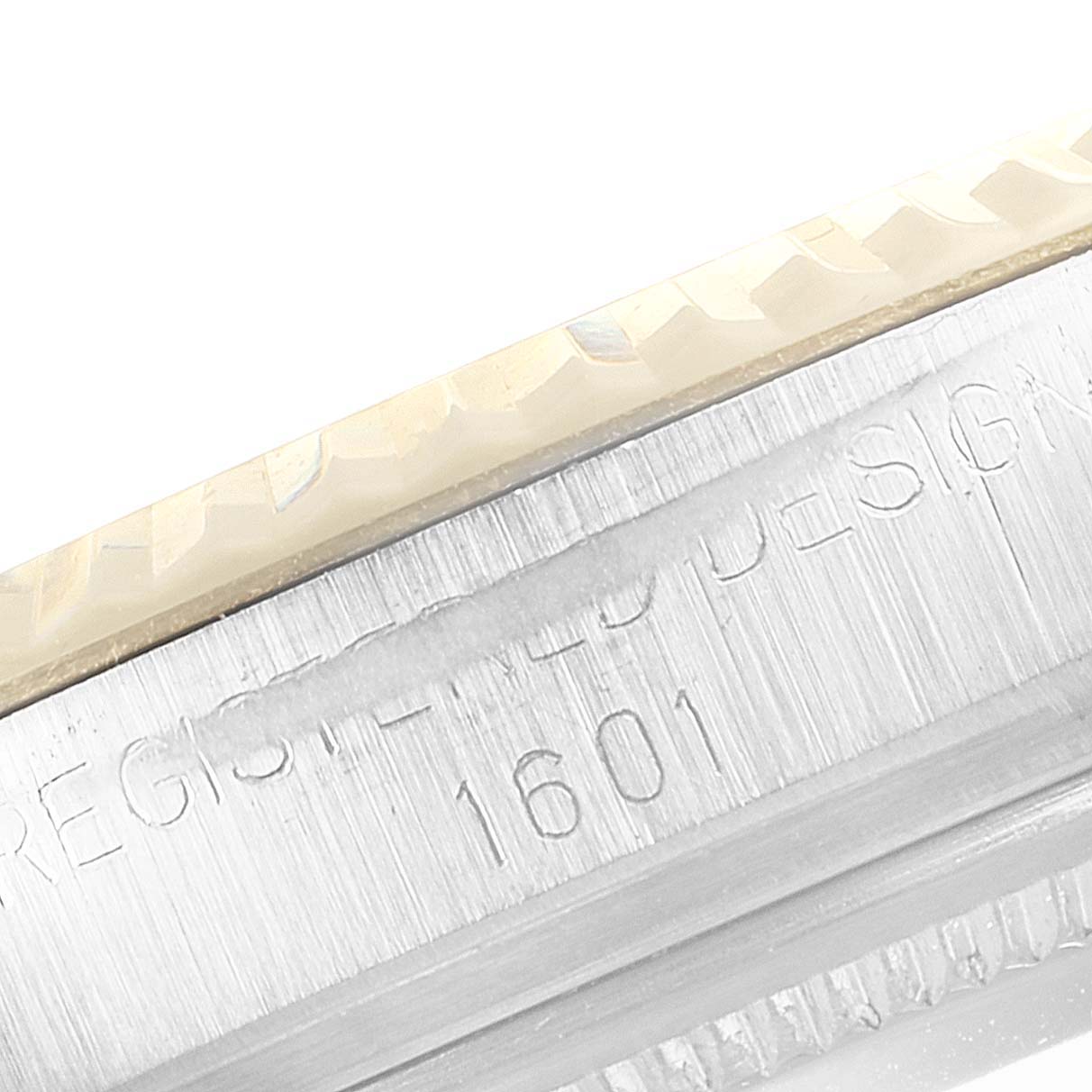 The image shows a close-up of the bezel and case side of a Rolex Vintage Collection 1601 Men's Steel and Gold (two tone) Black Dial 1601 Men's Steel and Gold (two tone) Black Dial model 1601.