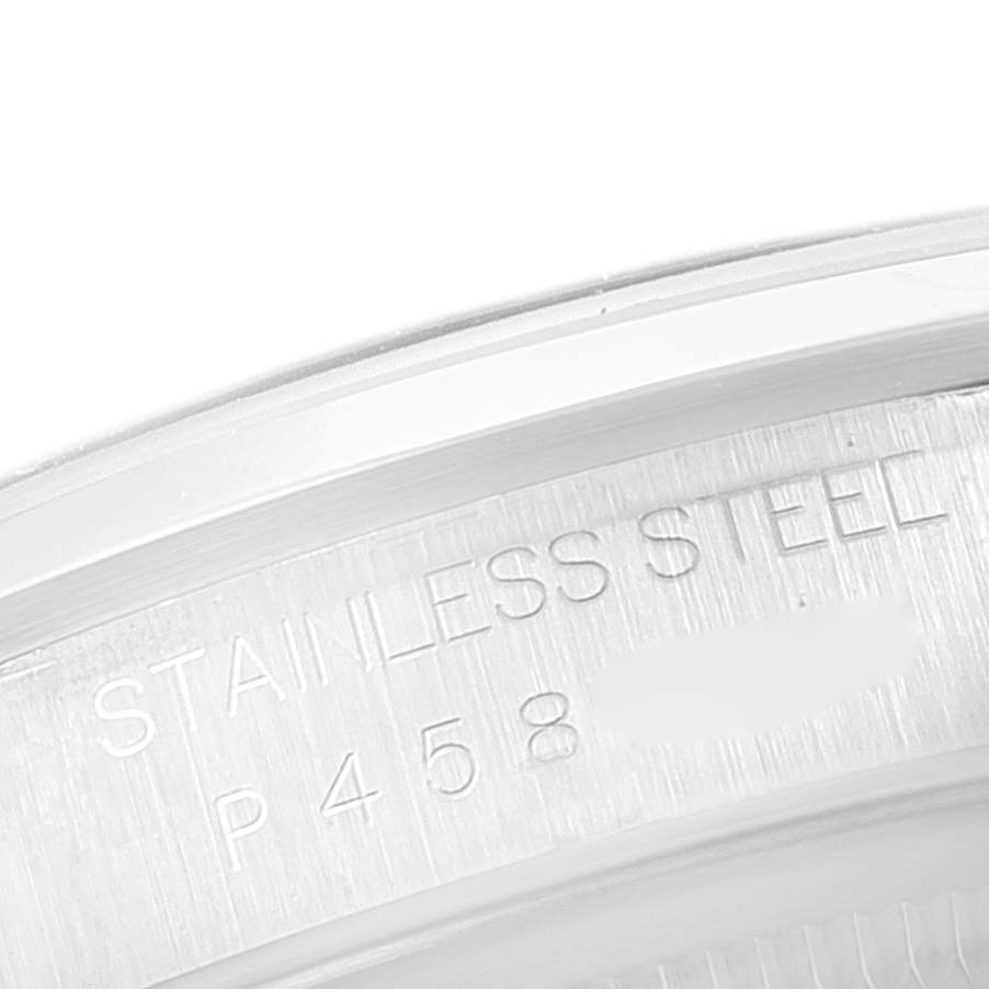 This image shows a close-up of the Rolex Datejust 16200 Men's Stainless Steel Blue Dial 16200 Men's Stainless Steel Blue Dial watch case's inner rim, featuring "STAINLESS STEEL" engraved.