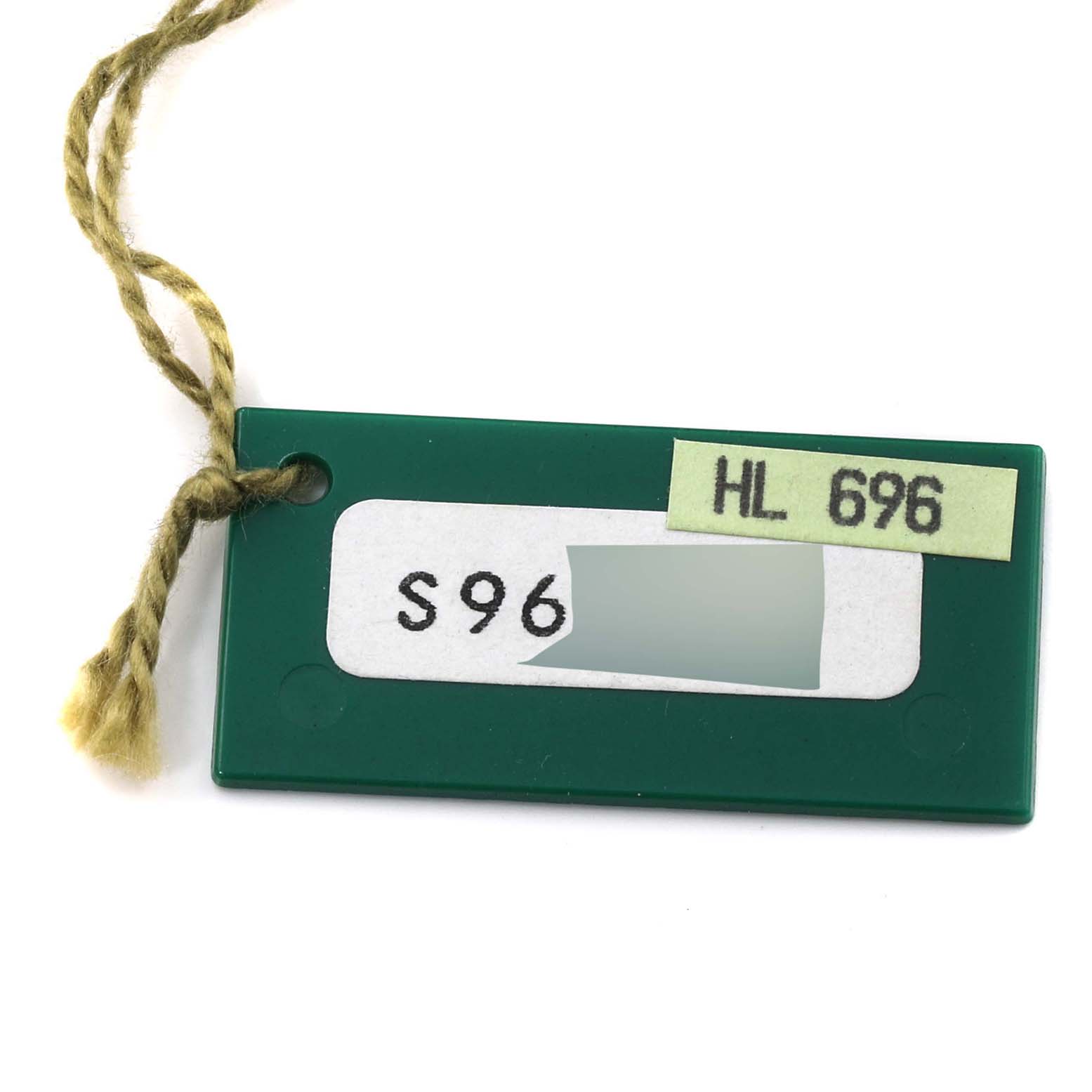 This image shows a green tag with attached string, likely an accessory for a Datejust model by Rolex.