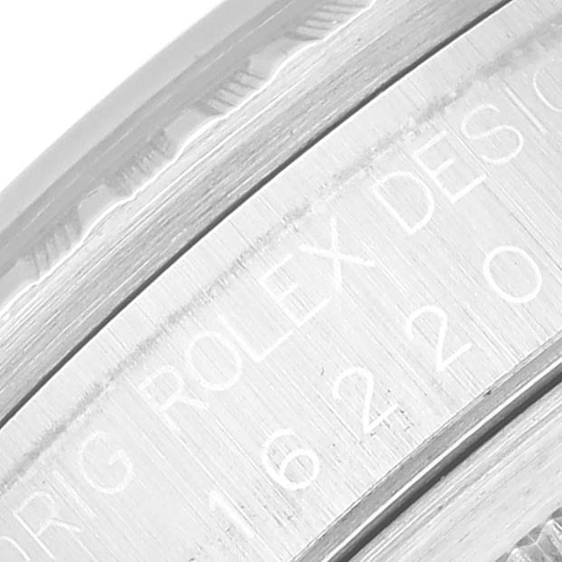 This image shows a close-up of the engraved text on the case side of a Rolex Datejust 16220 Men's Stainless Steel Black Dial 16220 Men's Stainless Steel Black Dial watch.