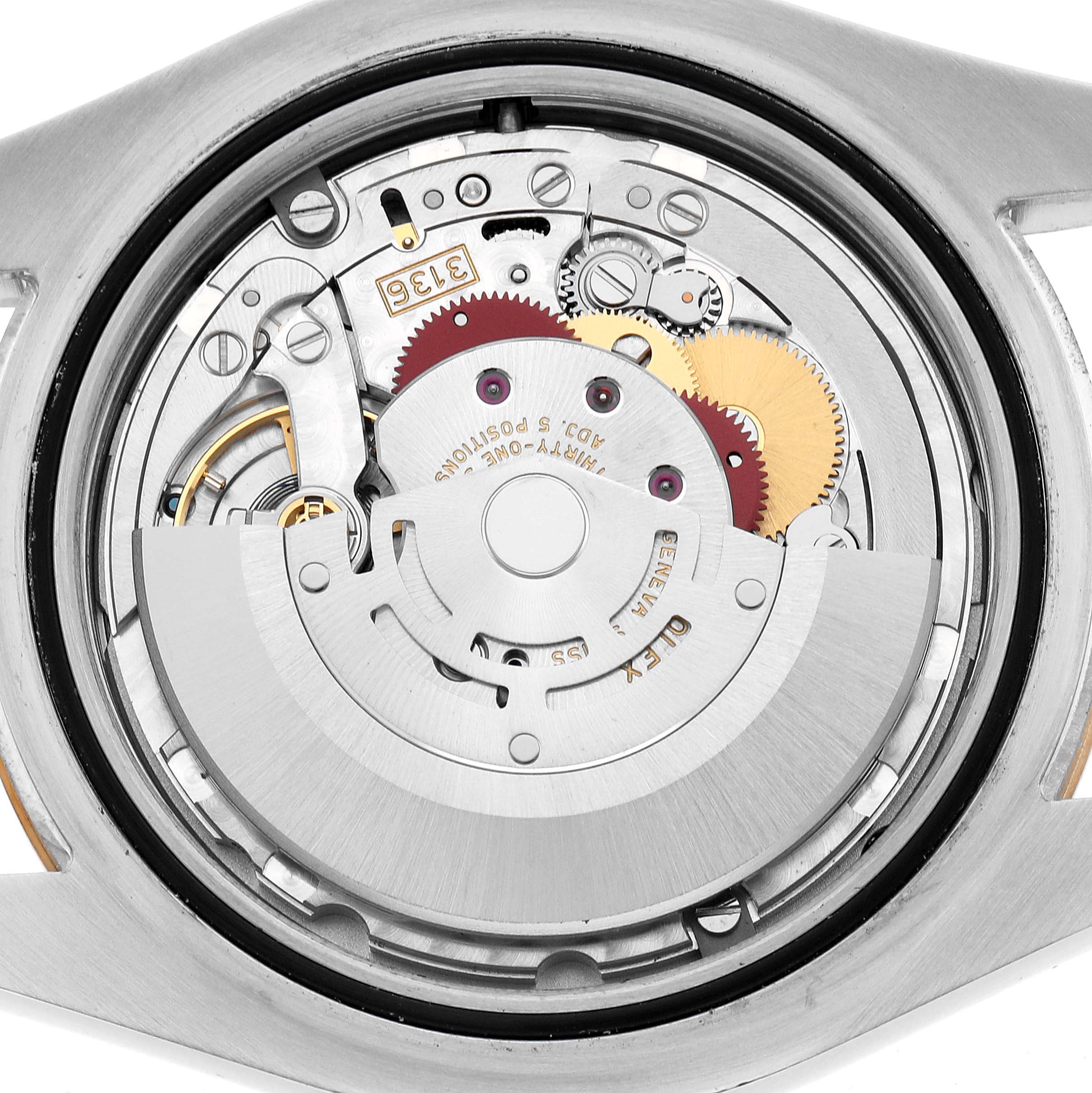 The image shows the internal mechanism of a Rolex Datejust 41 116333 Men's Steel and Gold (two tone) Champagne Dial from a rear angle, highlighting gears and the rotor.