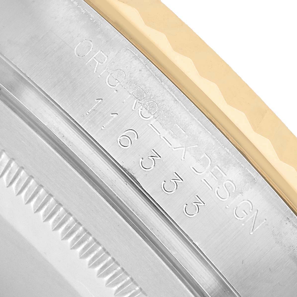 The image shows a close-up of the engraving on the side of the bezel of a Rolex Datejust 41 116333 Men's Steel and Gold (two tone) Champagne Dial.