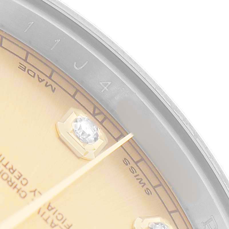 The image shows a close-up of the dial and bezel of a Rolex Datejust 41 116333 Men's Steel and Gold (two tone) Champagne Dial, highlighting a diamond marker and part of the minute track.