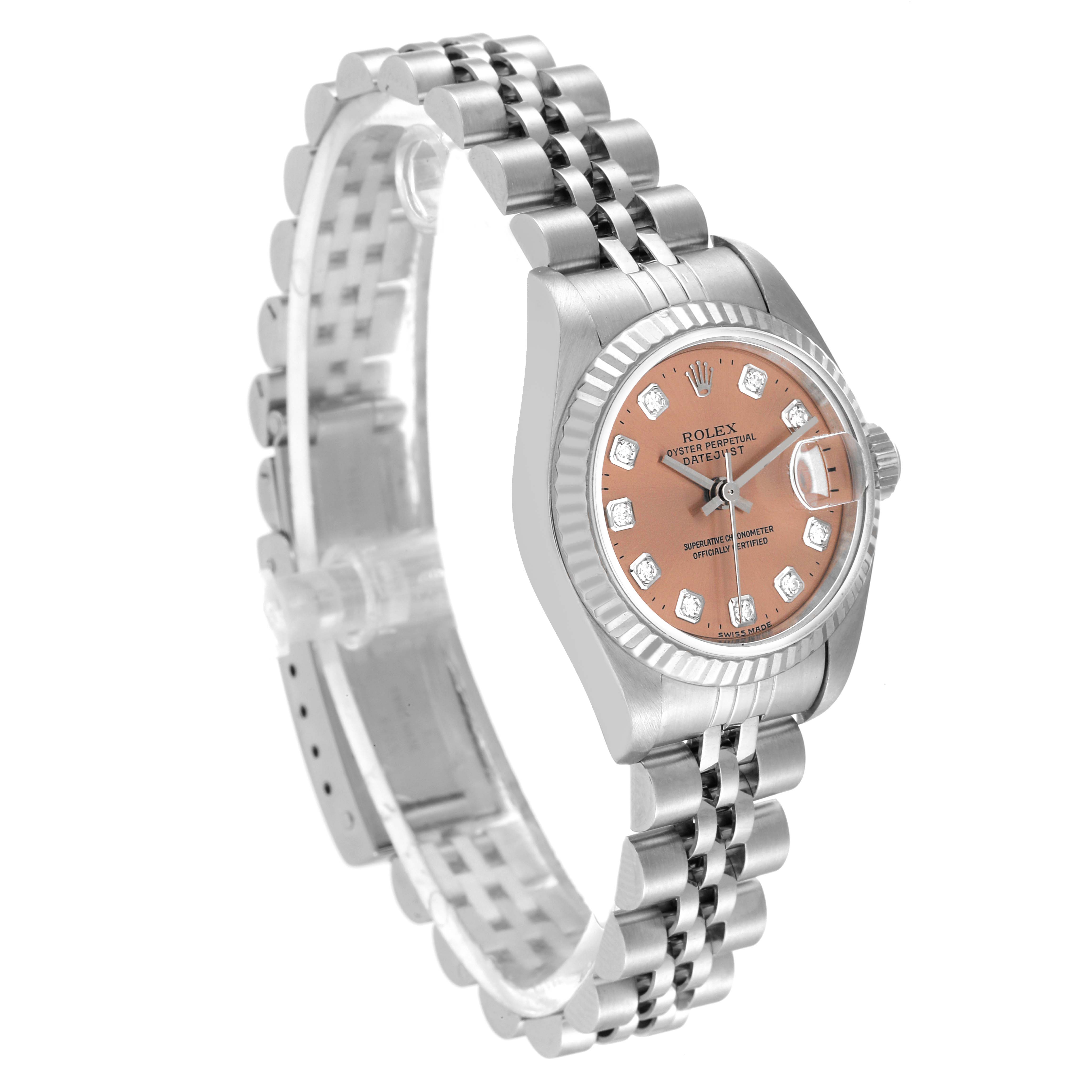 The image shows a Rolex Datejust 79174 Women's Stainless Steel Pink Dial 79174 Women's Stainless Steel Pink Dial watch at an angle displaying its salmon-colored dial, bezel, case, crown, and bracelet.
